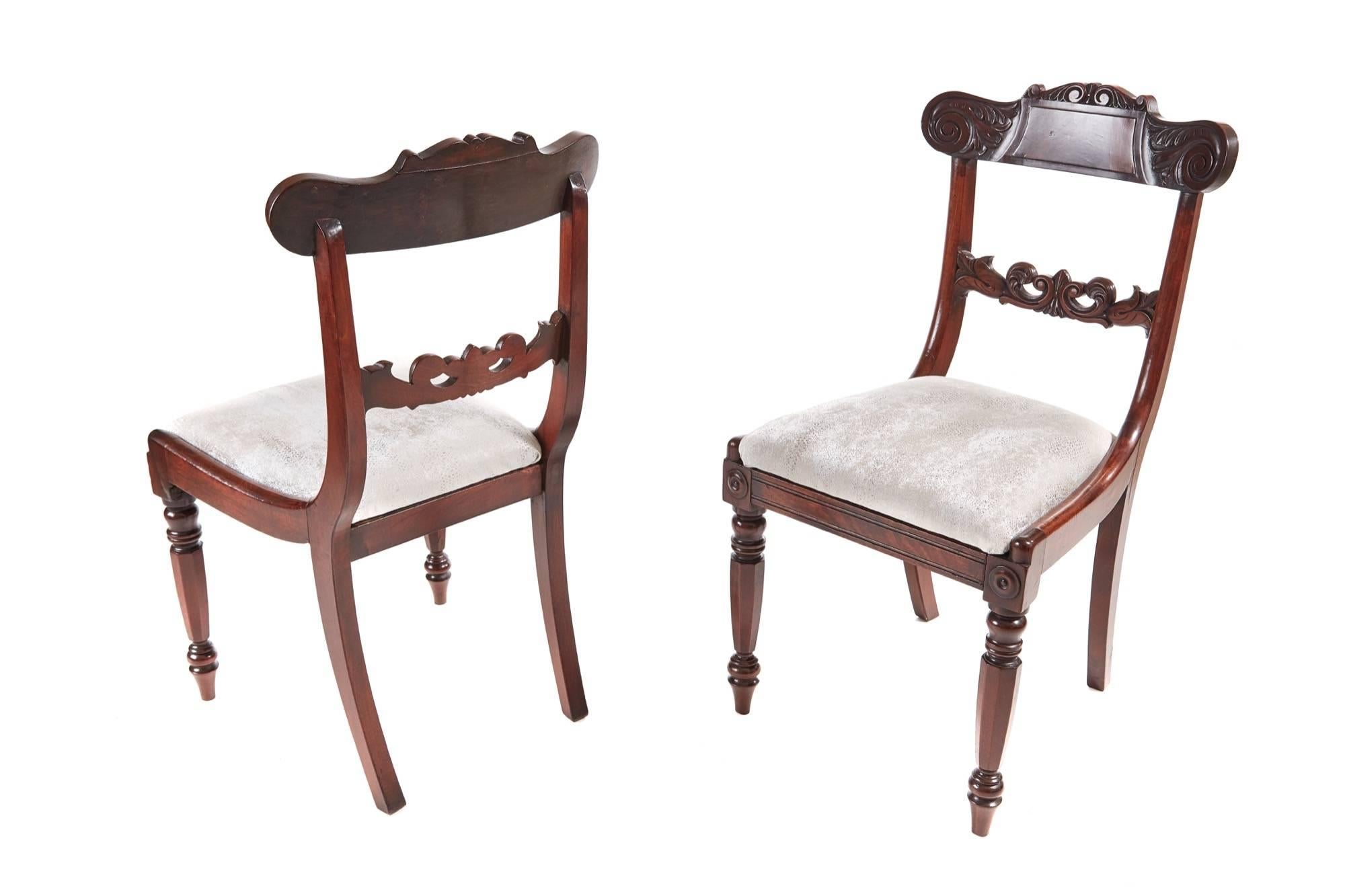 Pair of William IV mahogany side chairs, having ornate carved backs and centre rails, drop in seats newly recovered standing on shaped turned legs to the front outswept back legs
Lovely color and condition.