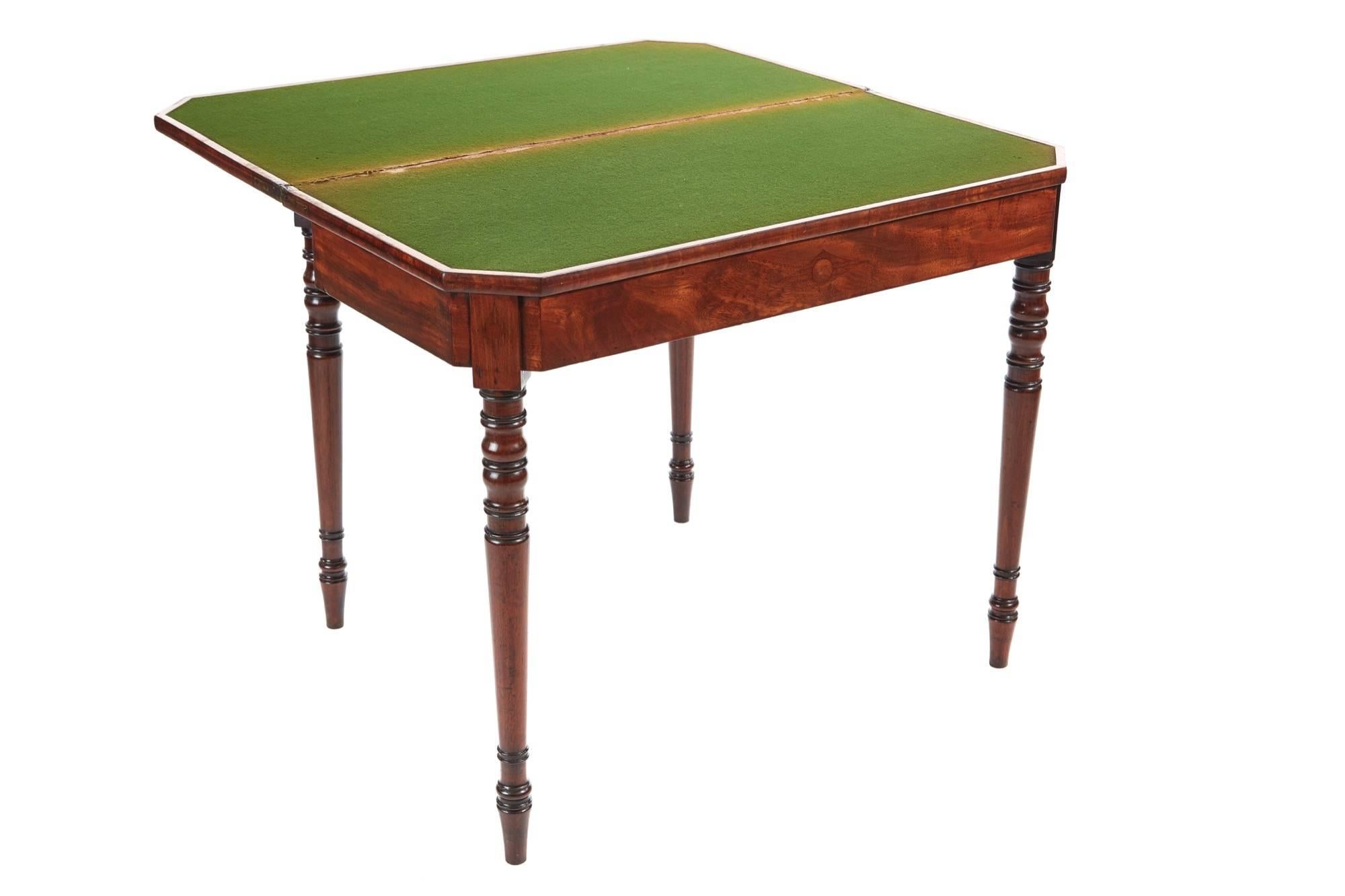 George III mahogany card table, with a lovely quality mahogany top, crossbanded in rosewood, original green baize and satinwood crossbanding, double gateleg support for the hinged fold over top, inlaid frieze, standing on turned legs.