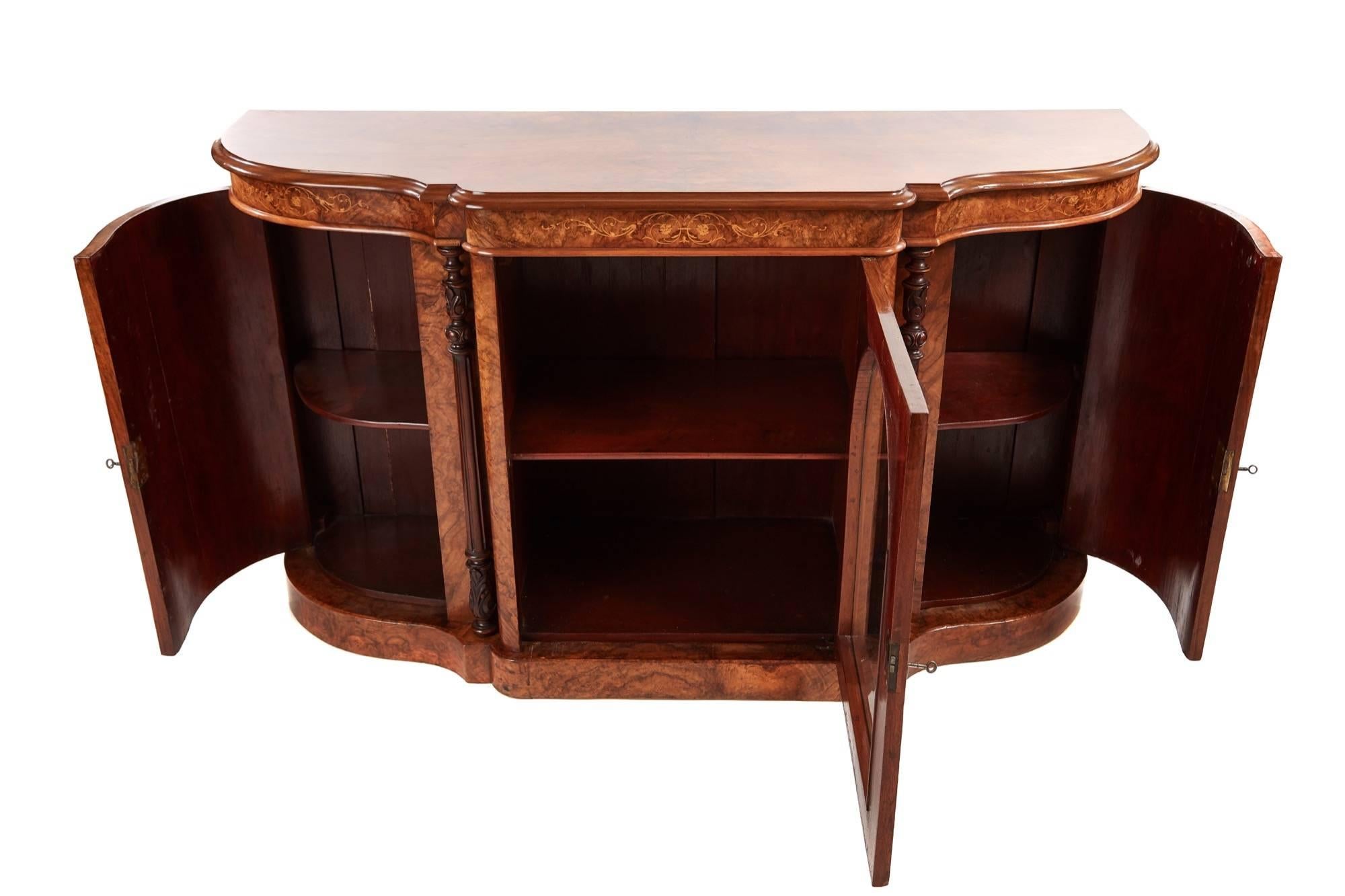 Super quality Victorian burr walnut inlaid credenza, with a lovely burr walnut shaped top, thumb moulded edge, above a glazed centre door, having carved fluted pilasters to either side, the bowed walnut doors having fine boxwood inlay, enclosing