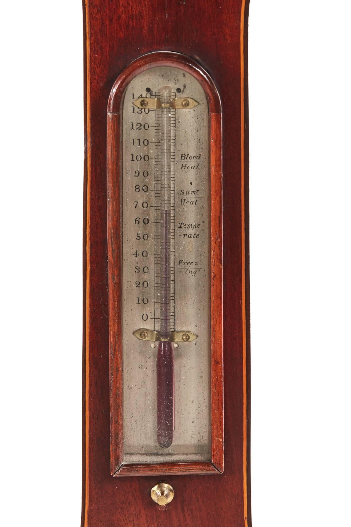Georgian mahogany banjo barometer, with a swan neck pediment, satinwood stringing, thermometer, small mirror and a silver 9