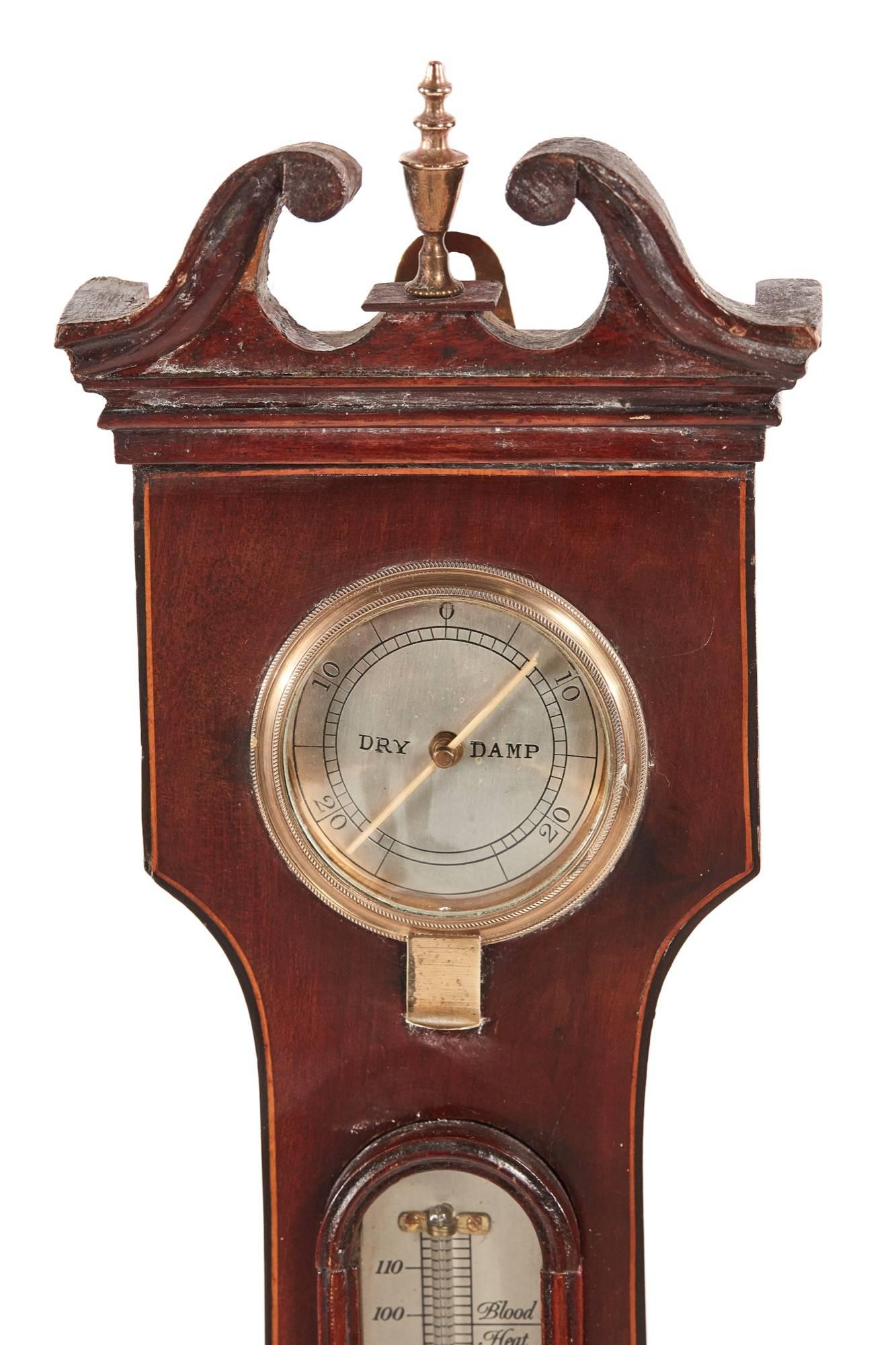 Georgian mahogany banjo barometer. with a swan neck pediment, lovely mahogany case, thermometer, round mirror, 9