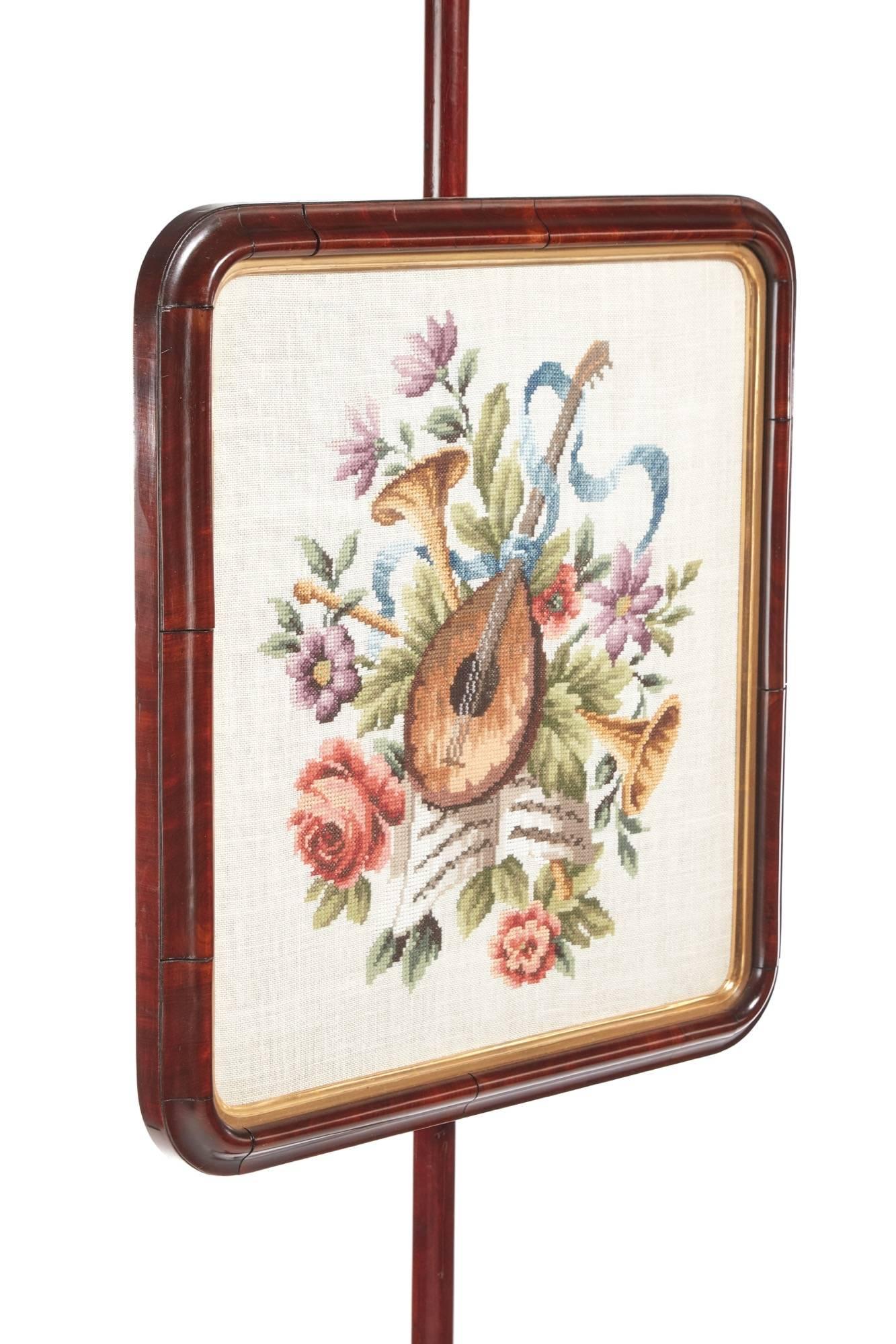 Quality Victorian mahogany pole screen, with a needlepoint picture in a mahogany frame, supported by a mahogany pole, the base with quality carved shaped column, standing on three quality carved shaped cabriole legs
Lovely color and