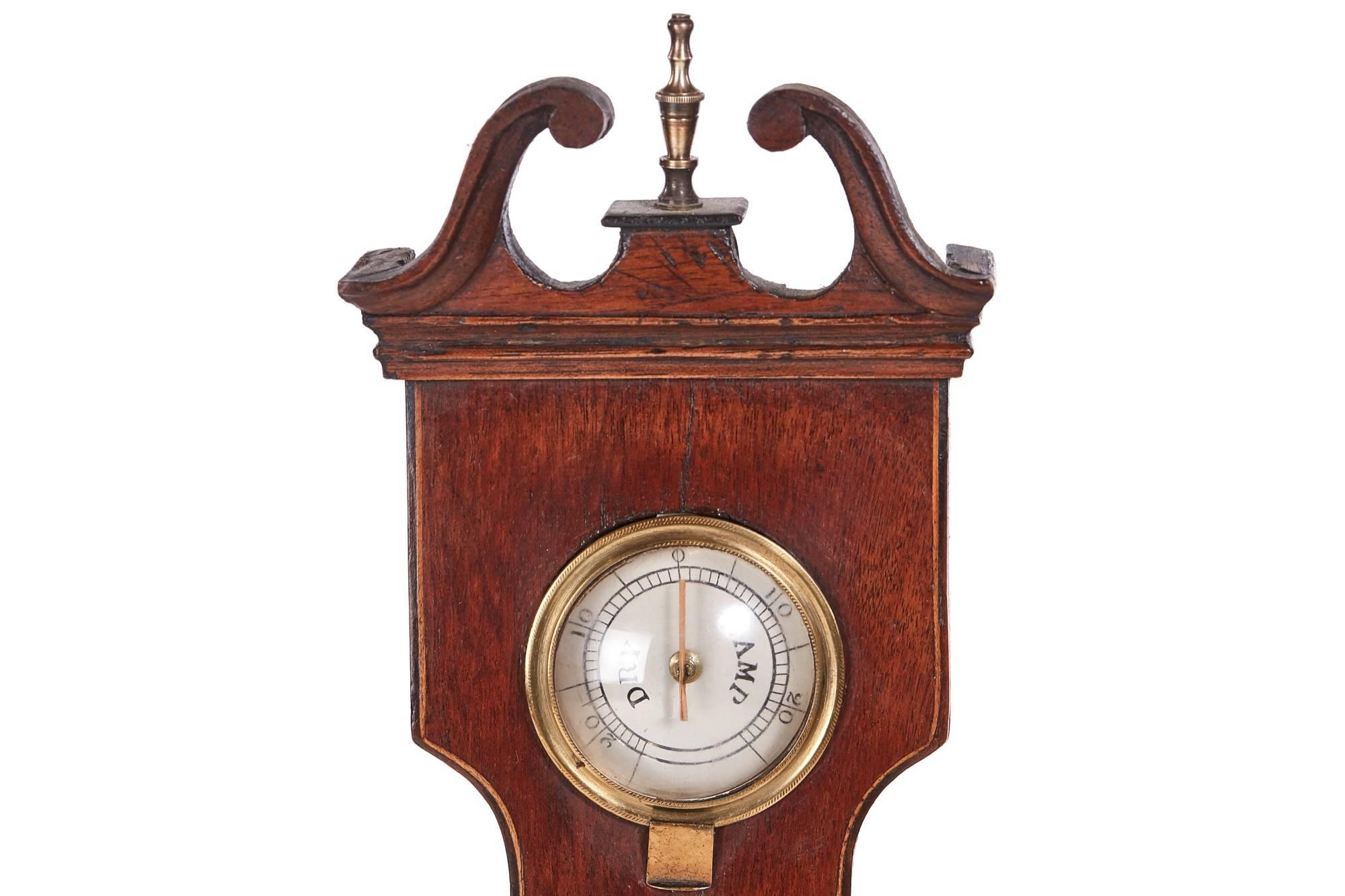 Georgian mahogany banjo barometer, with a swan neck pediment, satinwood stringing, thermometer, small mirror and a silver 9