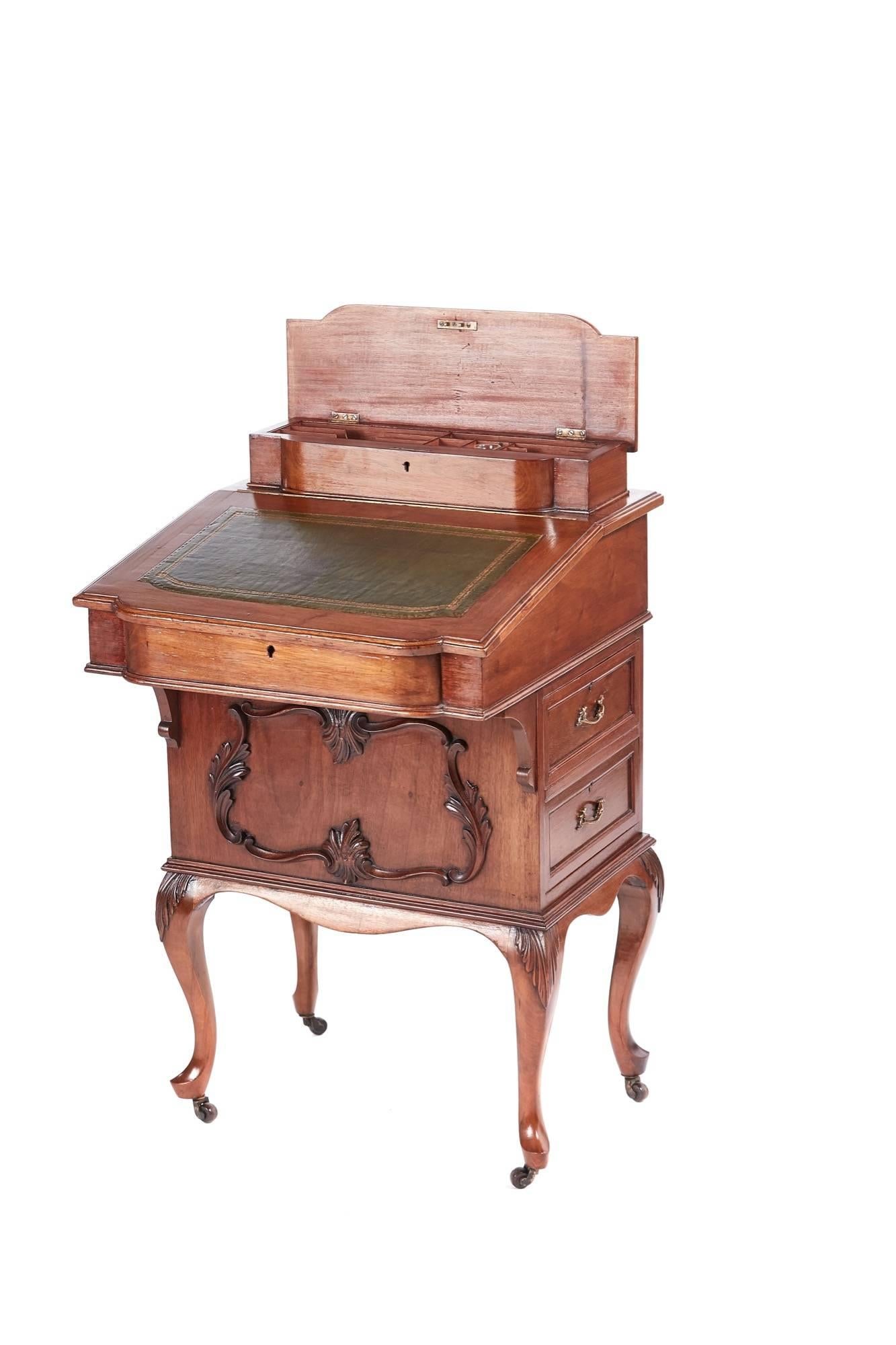Victorian freestanding walnut davenport, lift up lid with fitted interior, shaped writing surface, lovely carved front, the right hand side has two drawers with original brass handles, the left side has two false drawers with original brass handles,
