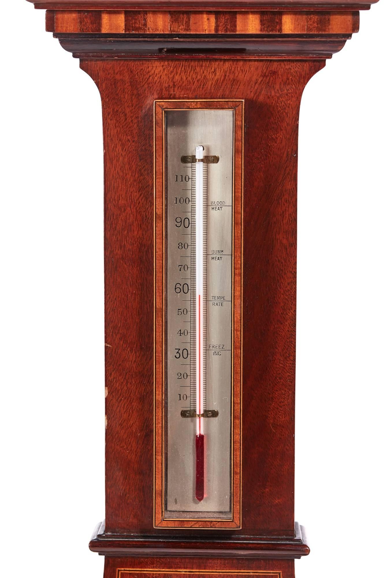 Large antique mahogany inlaid barometer, with a shaped inlaid pediment, lovely satinwood inlay to the case, thermometer and a silver dial
Working order
Lovely color and condition
Measures: 12