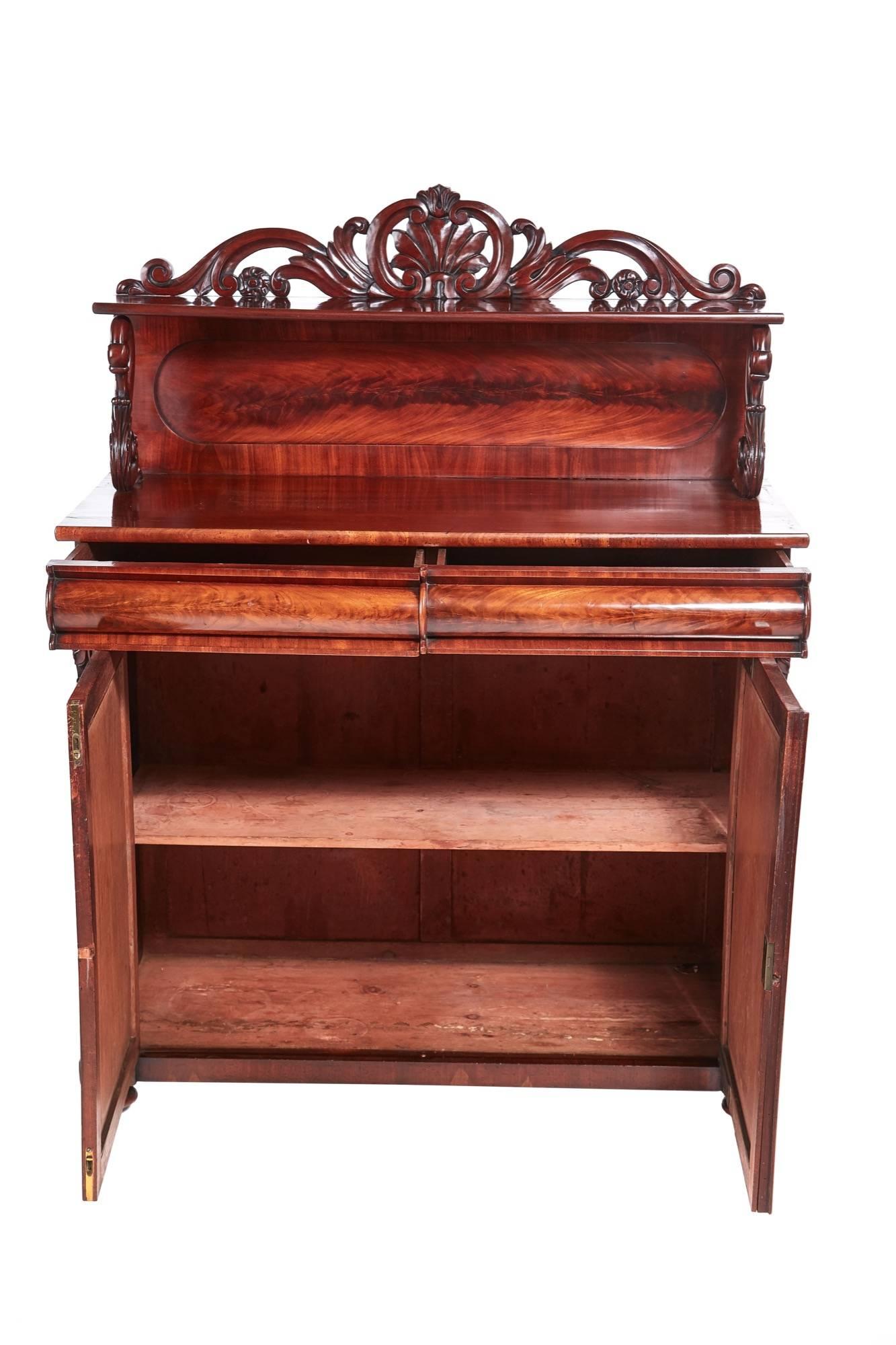 Quality Victorian mahogany chiffonier, lovely carved back with a shelf, unusual carved swans supports, the base with two frieze drawers two flame mahogany doors with arced panels, nice carved corbels each side, one shelf inside, standing on small