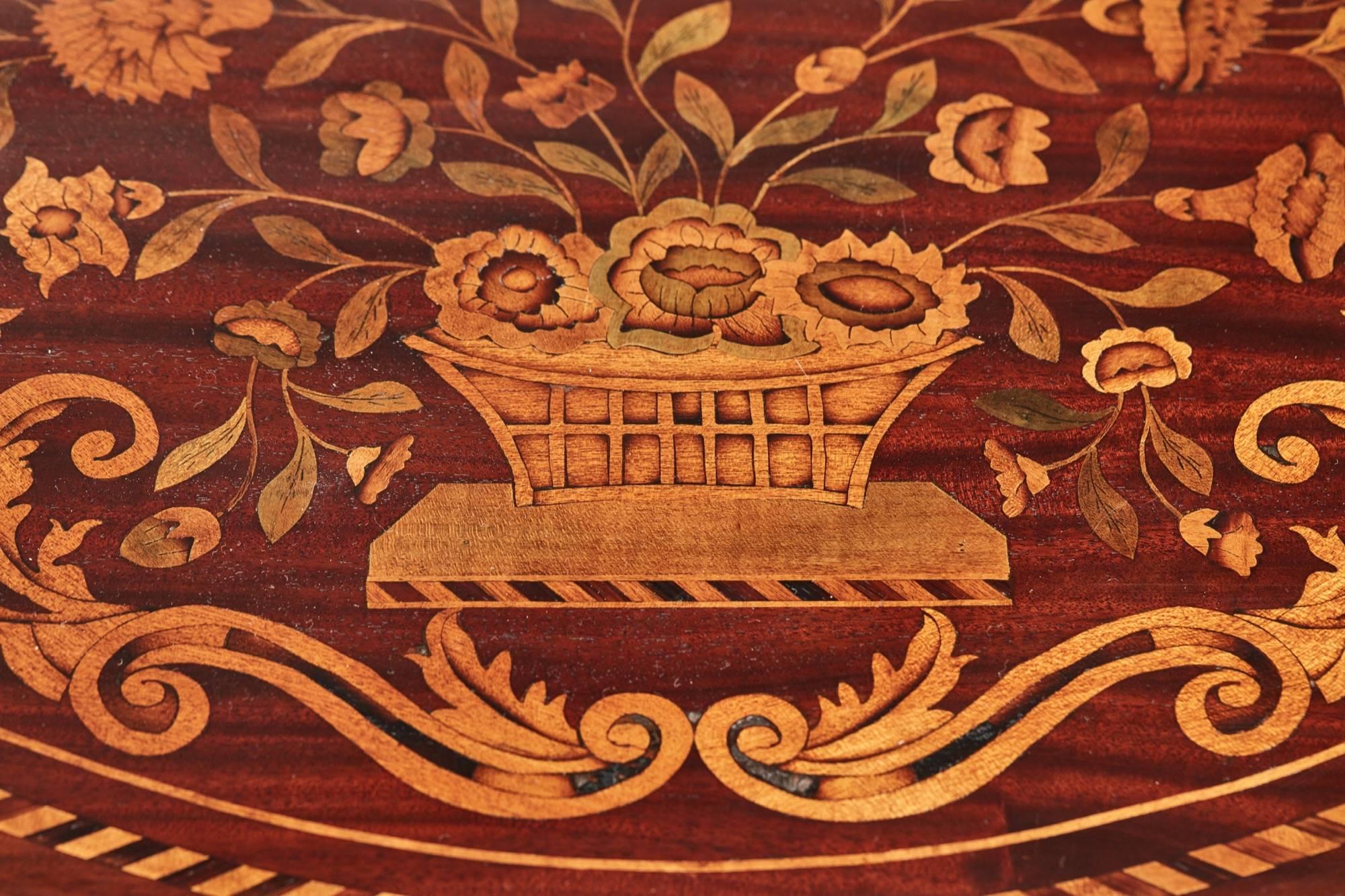 Fine pair of 18th century Dutch marquetry console tables, having fantastic inlaid marquetry tops with baskets of flowers surrounded by scrolls and flower heads and rope twist banding, lovely marquetry inlaid frieze, supported by three marquetry