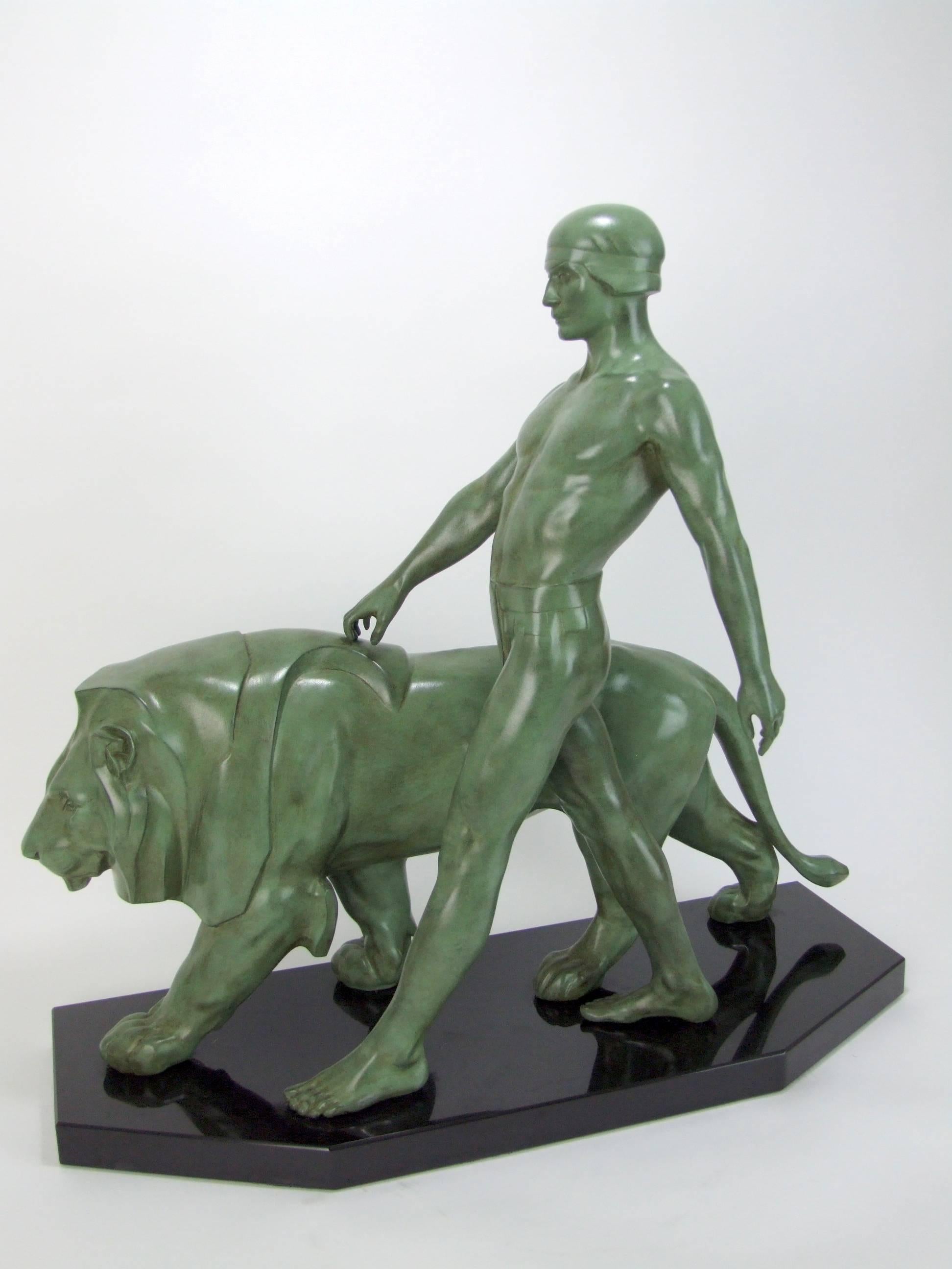 'Bellauer' or Gladiator by Max Le Verrier. A very large and rare Art Deco figural group of a man and lion, made of art metal and signed Le Verrier to the metal. This figure does not come up for sale very often. Mounted on a Belgian black marble base