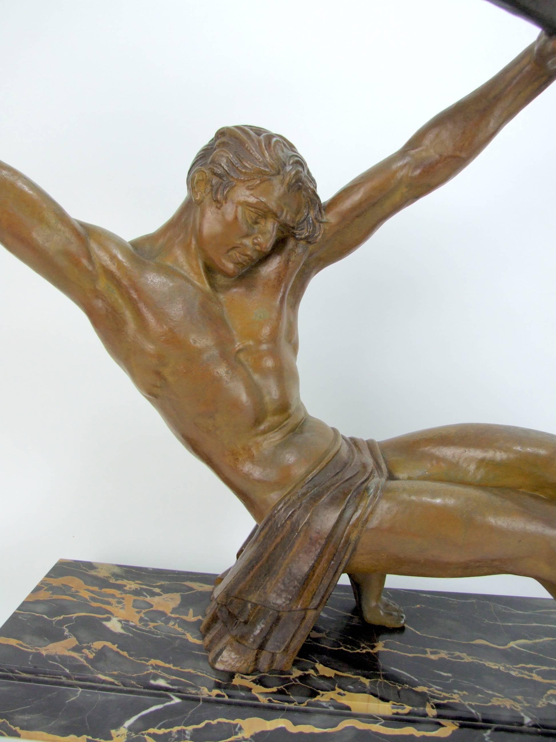 Large French Art Deco spelter male statue by Demetre Chiparus. This is the largest version of this statue and it measures 30 inches long by 6.5 inches deep by 24 inches high (76cm x 16.5cm x 61cm). Signed to the right hand end of the base - D H