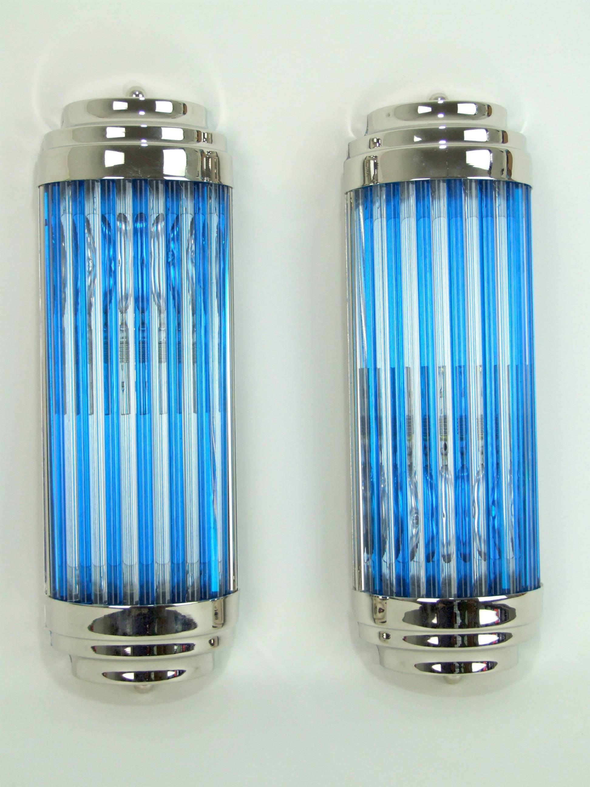 Stylish, new, chrome wall lights with clear and blue glass rods. Single bulb holder with each measures approx. 14 inches tall and 4.5 inches (35 x 12cm) wide. Condition is excellent as they are new. Wired and earthed. Also available in other colors,