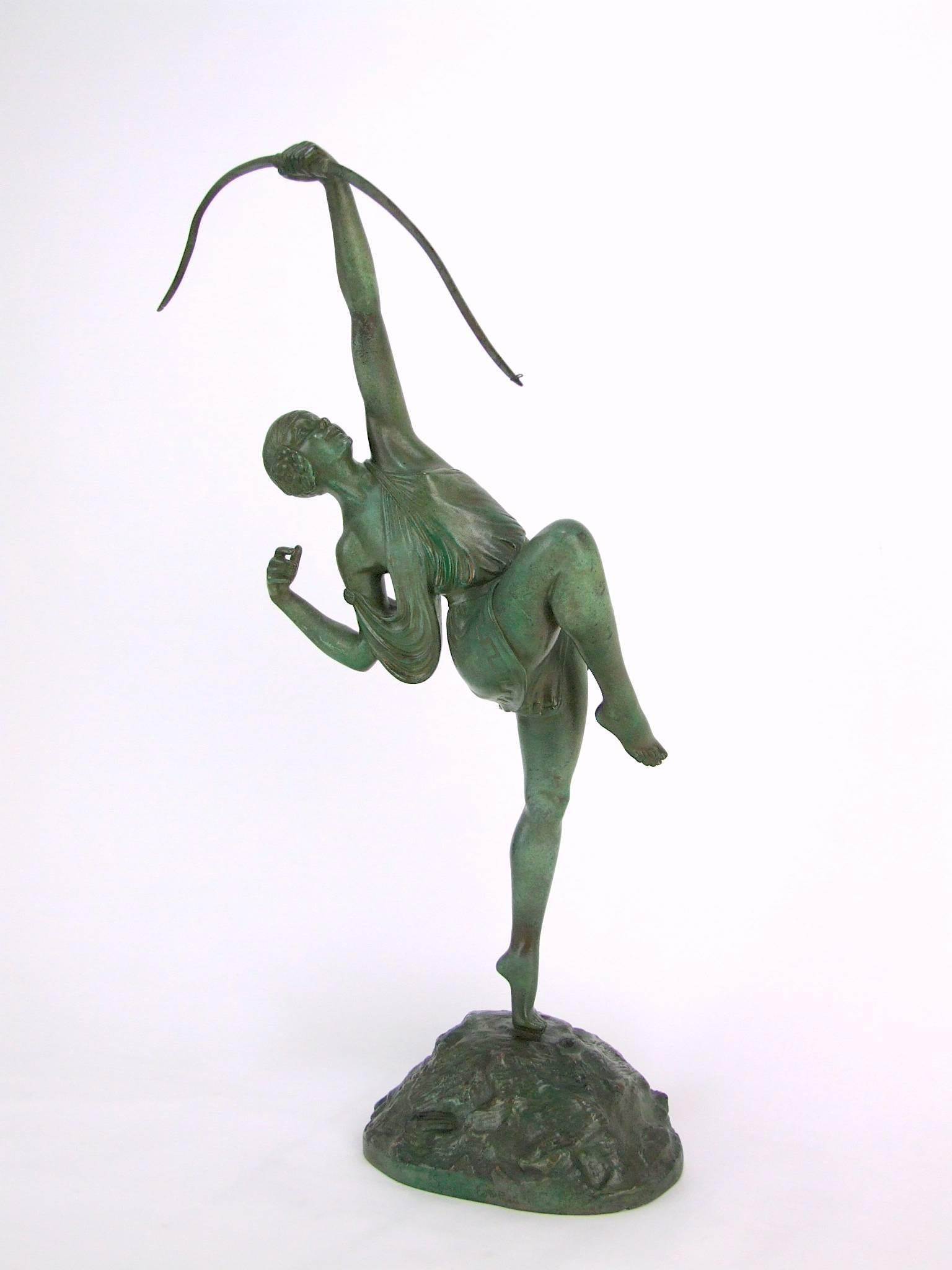 This piece is the medium size version of Danseuse a L'arc by Pierre Le Faguays and cast by the Susse Freres Fondeurs, Paris. (I also have the large version). This one measures nearly 18 inches high and has a green patina and her original bow, and is