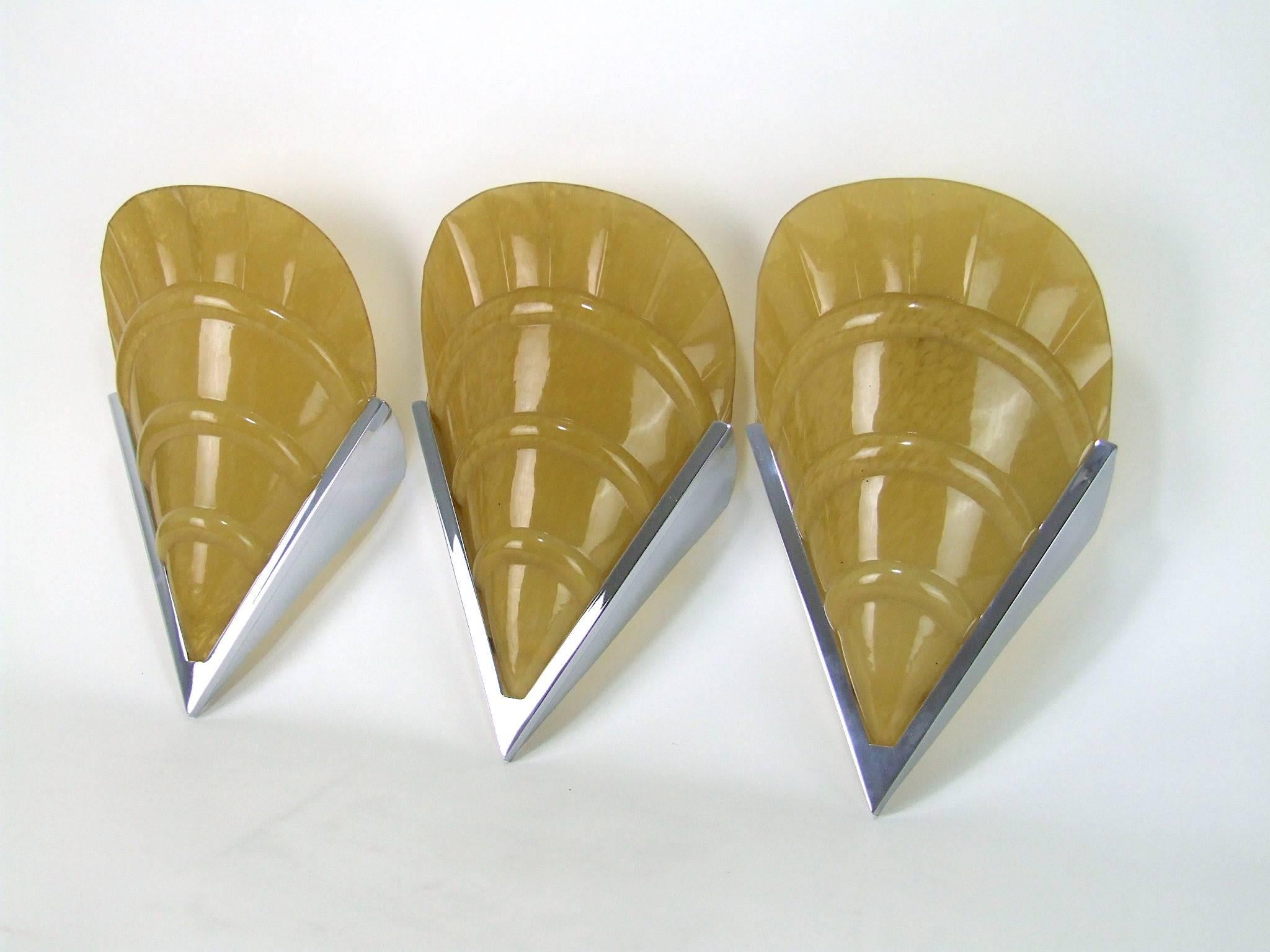 Set of three large oyster shell art deco wall lamps with gold mottled glass shades. They each measure a large 14 inches high by 9 inches wide (36cm x 23cm). In good vintage used condition. Photo shows the back of one without a light fitting but they