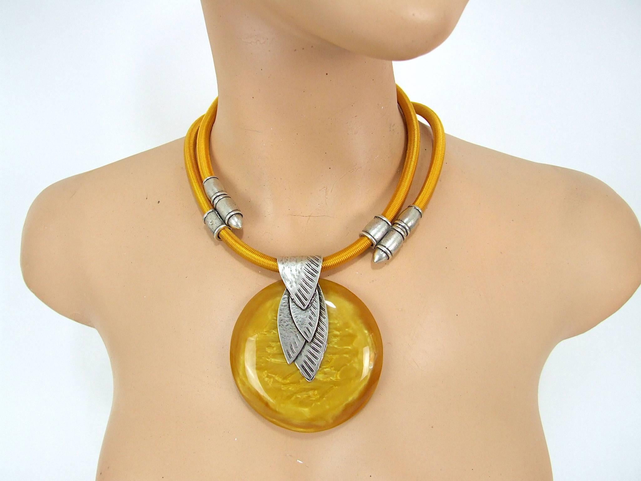 French Art Deco style designer modernist galalith necklace by Max Debraine. Pearlised yellow galalith with yellow silk cord hanger. Signed to the reverse. It hangs as short as 15 inches (38cm) around the neck to the cord and central panel. It is