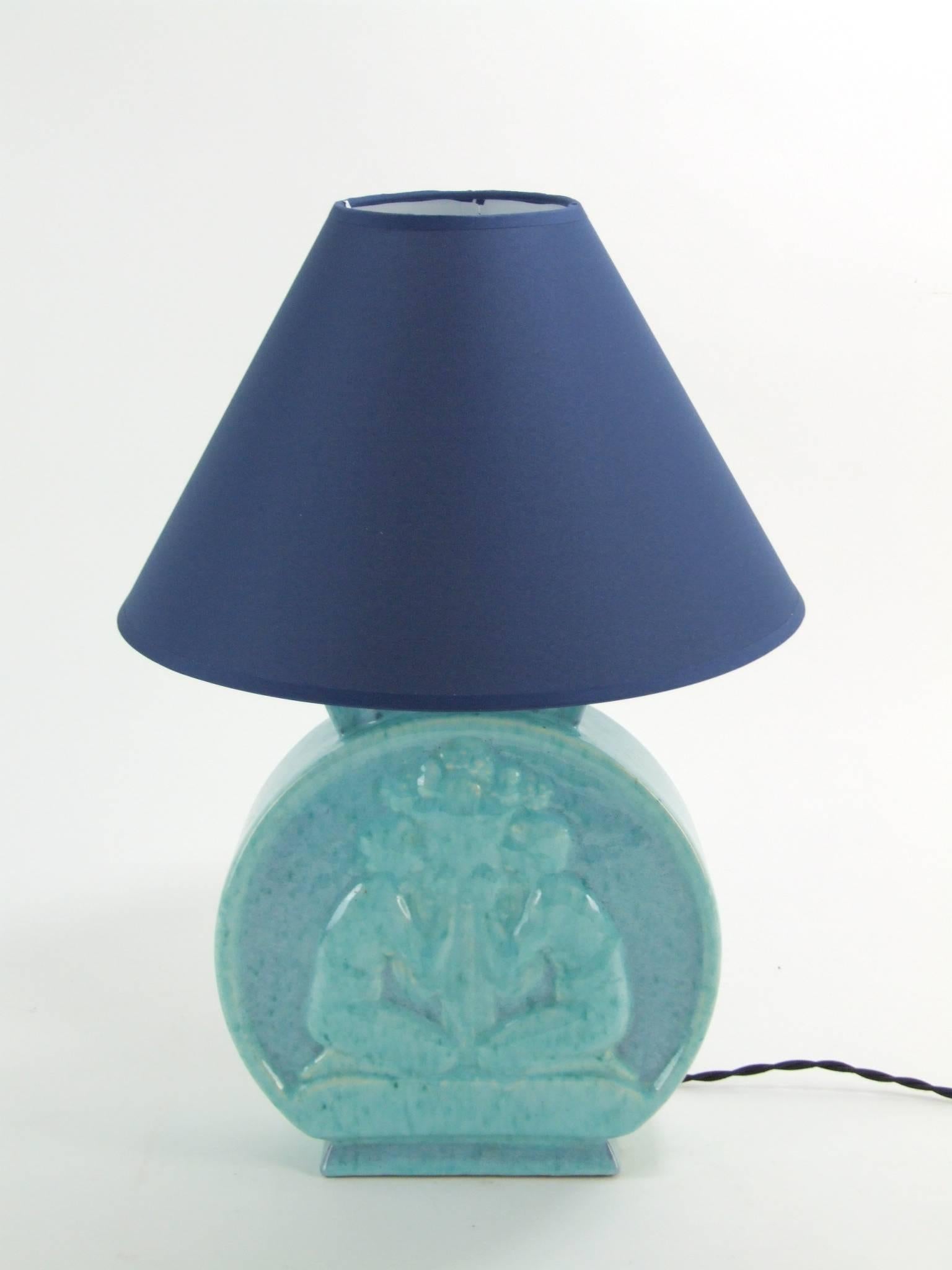 Art deco glazed terracotta table lamp. Designed by Andre Fau and produced by the Marcel Guillard foundry during the 1920s. Marked Boulogne under the base and bearing a foundry stamp and made in France. The shade measures. 12 inches in diameter and