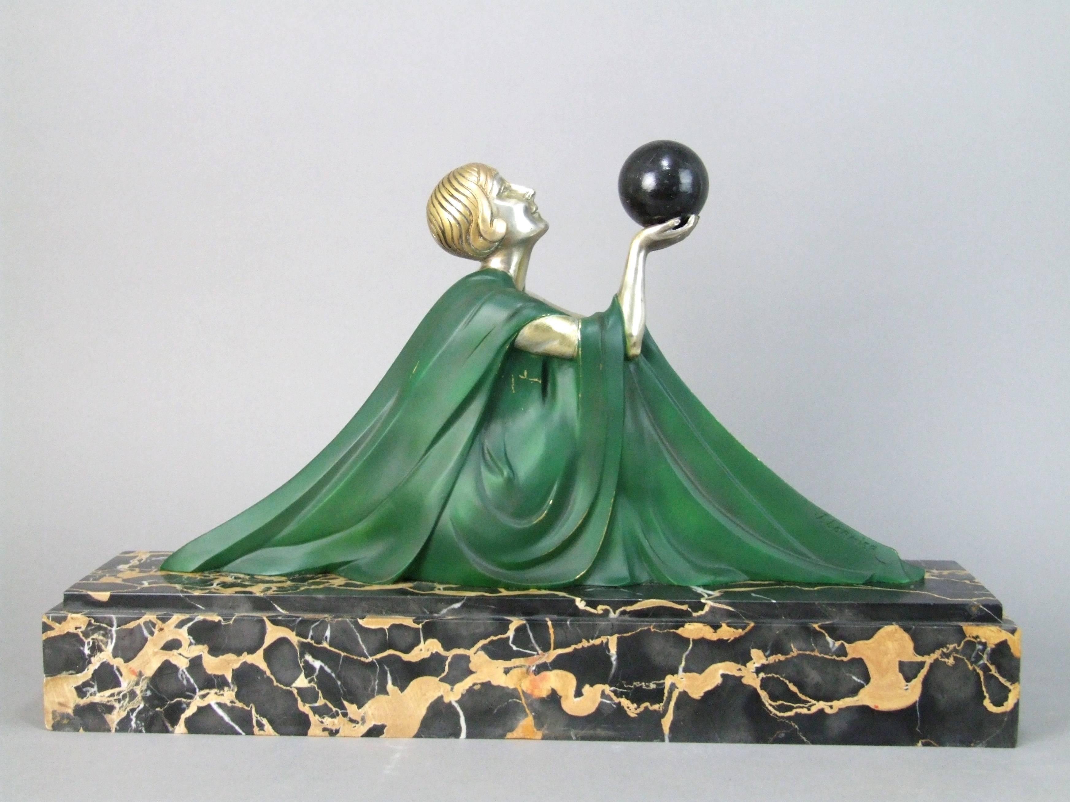 French Art Deco silvered bronze statue - Reverie by Lormier. She is mounted on a portorro marble base that measures 18.5 inches long by 5 inches deep by 12 inches high (47cm x 12.5cm x 30cm). Condition is very good with just a few tiny edge nibbles
