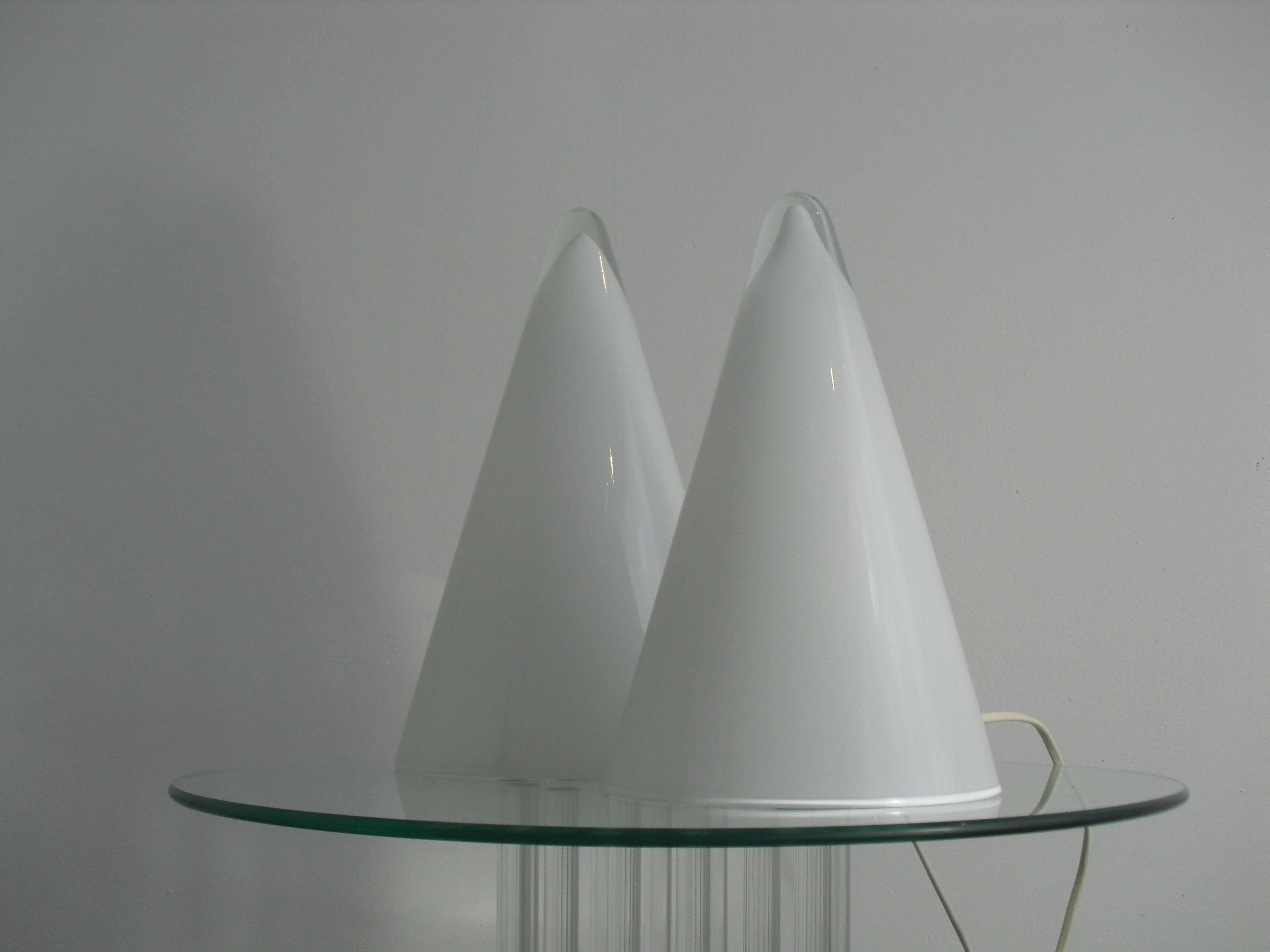 This pair of opal glass 'Iceberg' table lamps were made in France by SCE France during the 1980s.
The translucent top makes it look like ice.

Dimensions: H 32 & 26 cm x diameter 19 & 16 cm.
The bigger one has an European E27 socket, the smaller