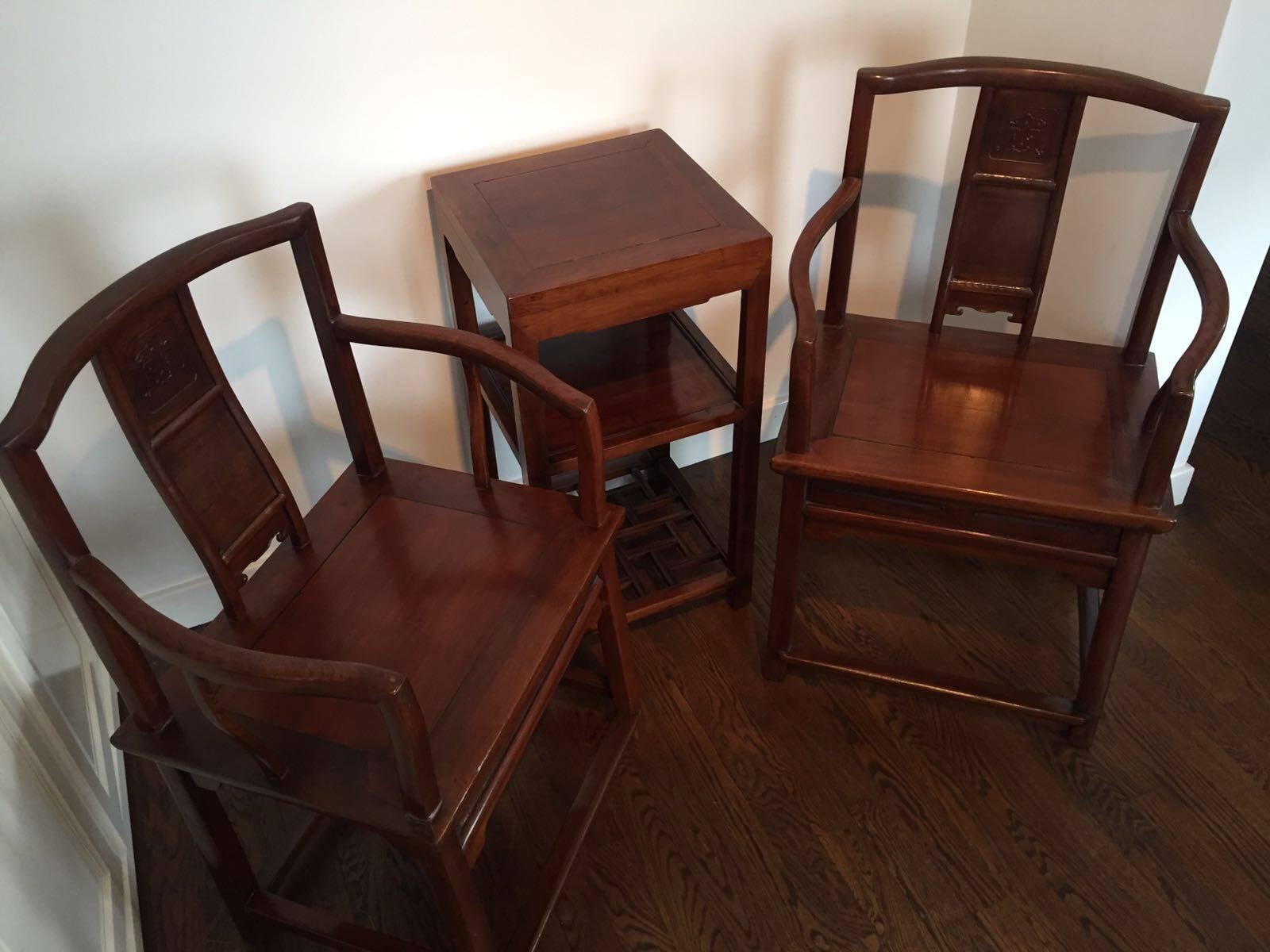 This antique fine carved rosewood set of two official's chairs and tea table, was made during the Qing dynasty, circa 1900.
All original lacquer.

Dimensions: Table H 75 cm x W 38 cm / Chairs H 89 cm x W 57 cm x D 45 cm.

Condition: Good