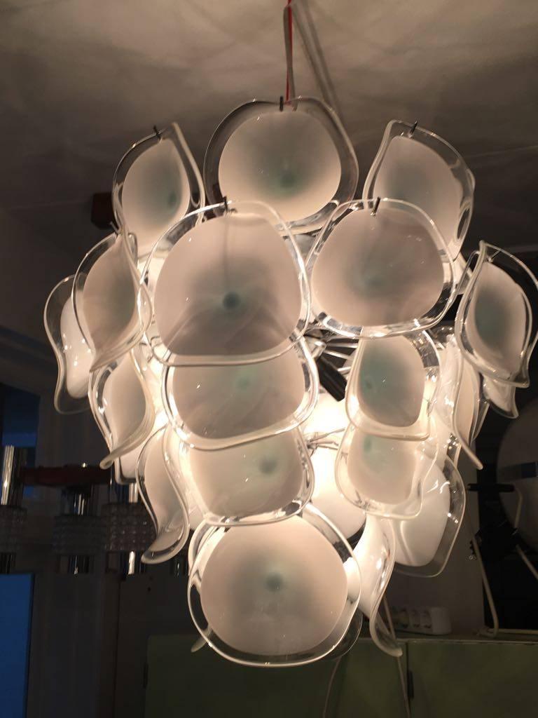 Stunning chandelier by Gino Vistosi for Mazzega Italy.

This chandelier is made of 36 handblown Murano glass discs.

All discs in excellent condition!

Measurements: H 54 cm / diameter 47 cm.