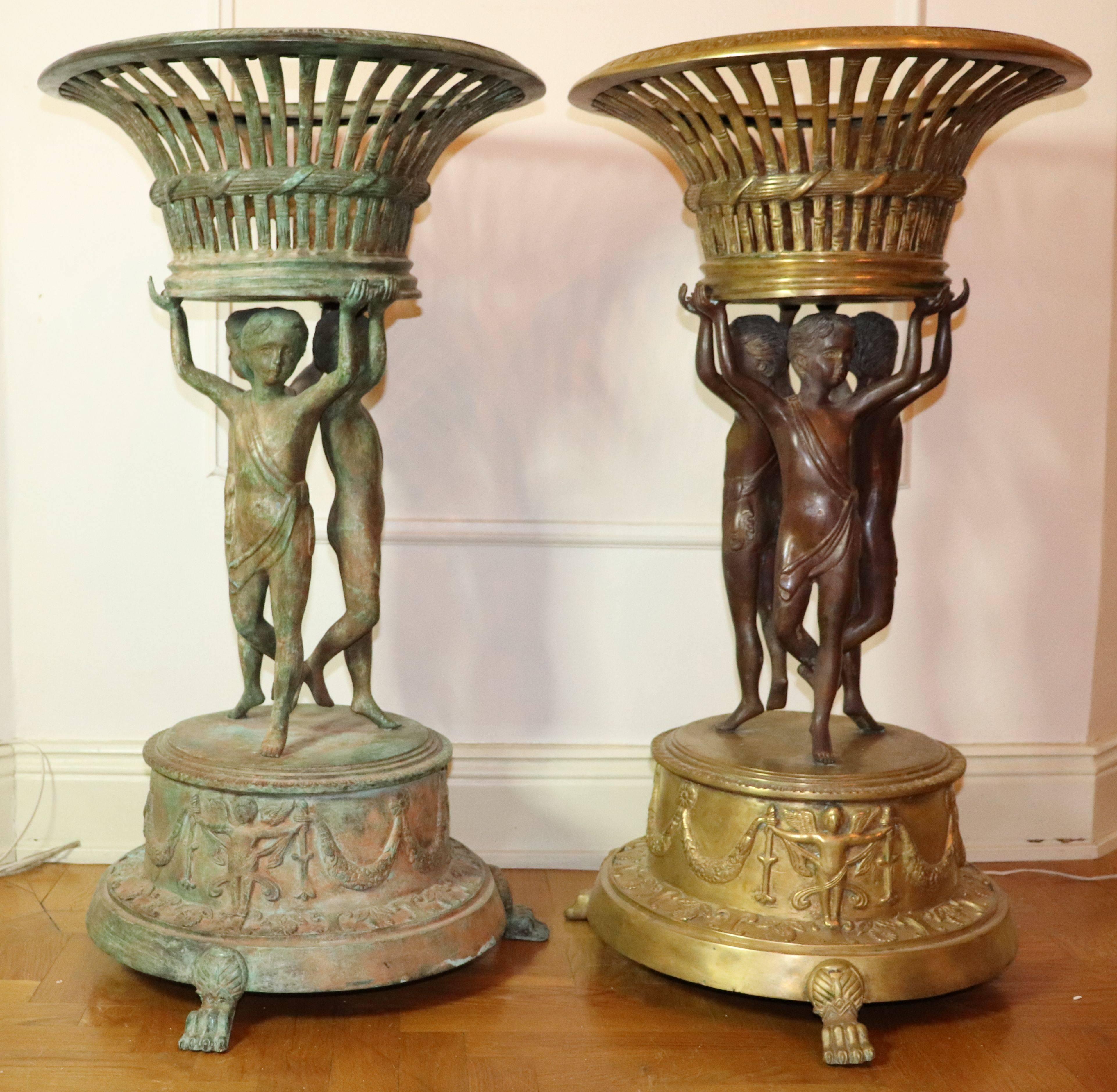 A pair of 19th century or earlier bronze planters/urns, one is cleaned other is still untouched height 95cm.