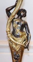Pair of Rococo Gilt Bronze Candelabra with Patinated Figures