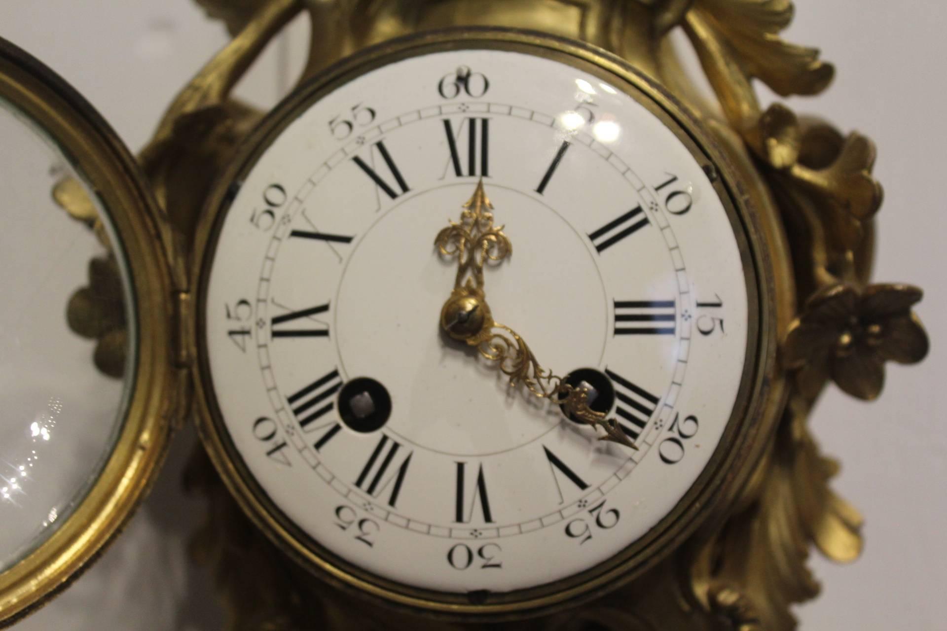 19th century, French Ormolu cartel clock, circa 1890.

This is a traditional pattern of case much beloved by French makers drawing on the 18th century designs which employ rococo swags and C scrolls and floral embellishments.

This fine movement of