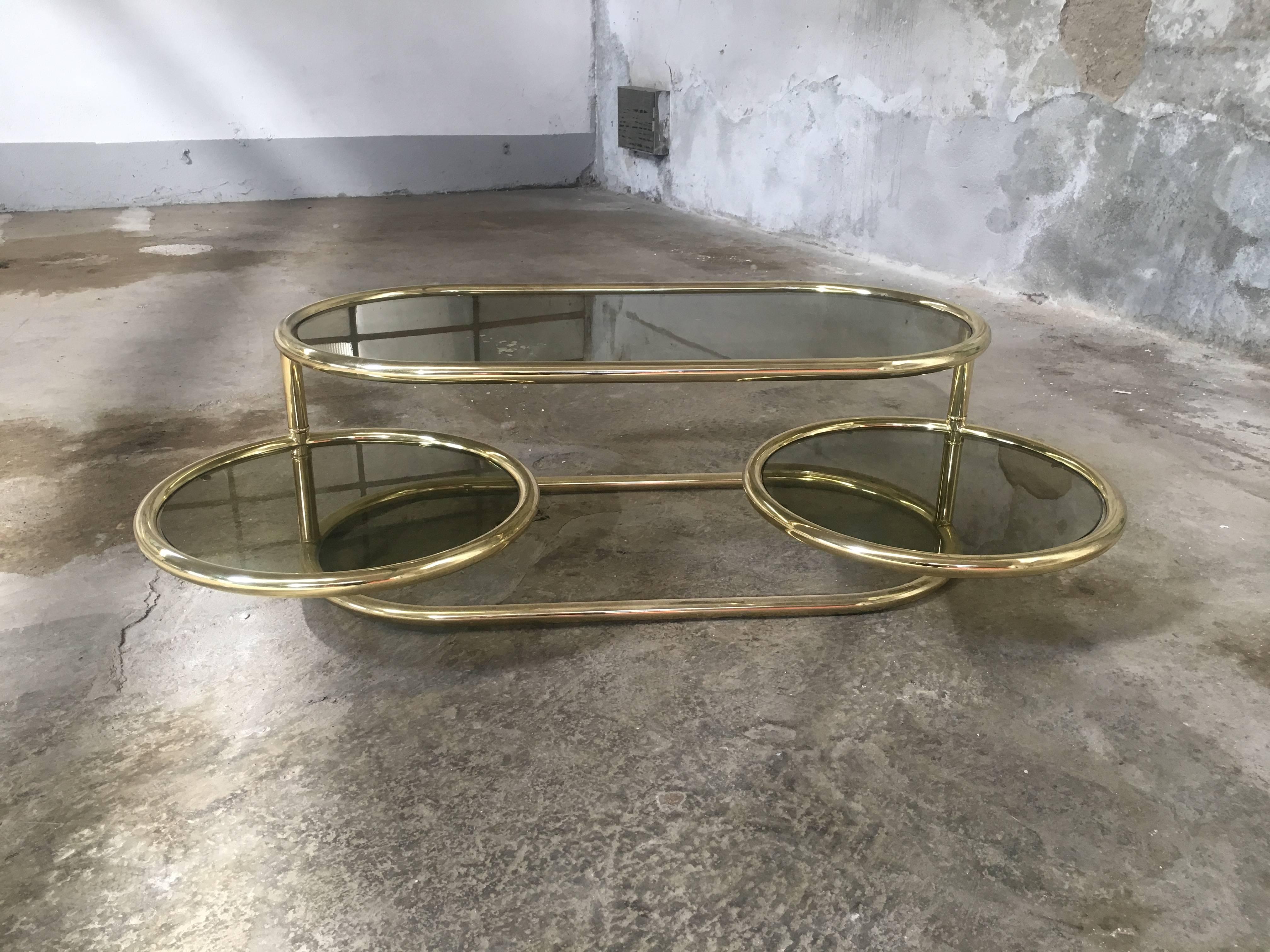 Italian Brass Metal coffee or side table with smoked glass and movable shelves from 1970s.