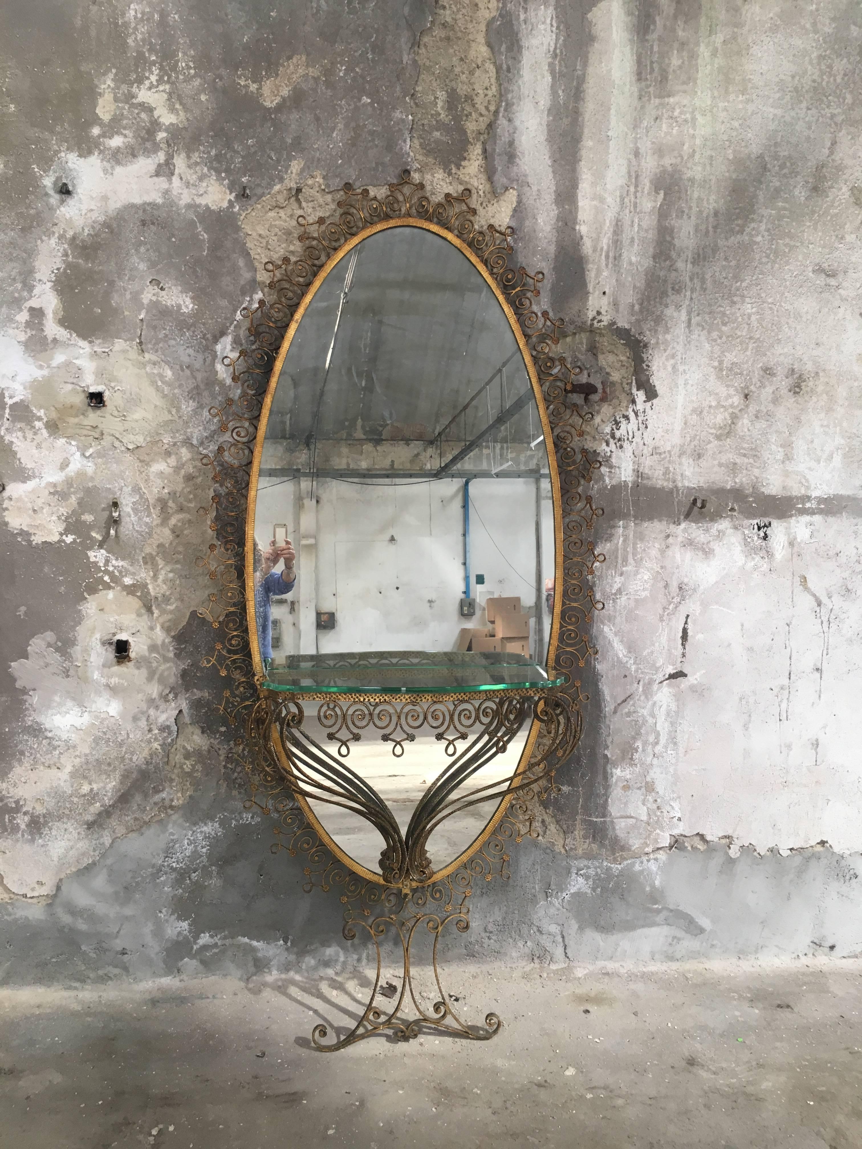 Monumental mirror with console having Verde Nilo Murano glass top by Pier Luigi Colli, Italy, 1955
Measurements:
Mirror: width cm.106, height cm.225
Console: width cm.79, depth cm.33, height cm.56.