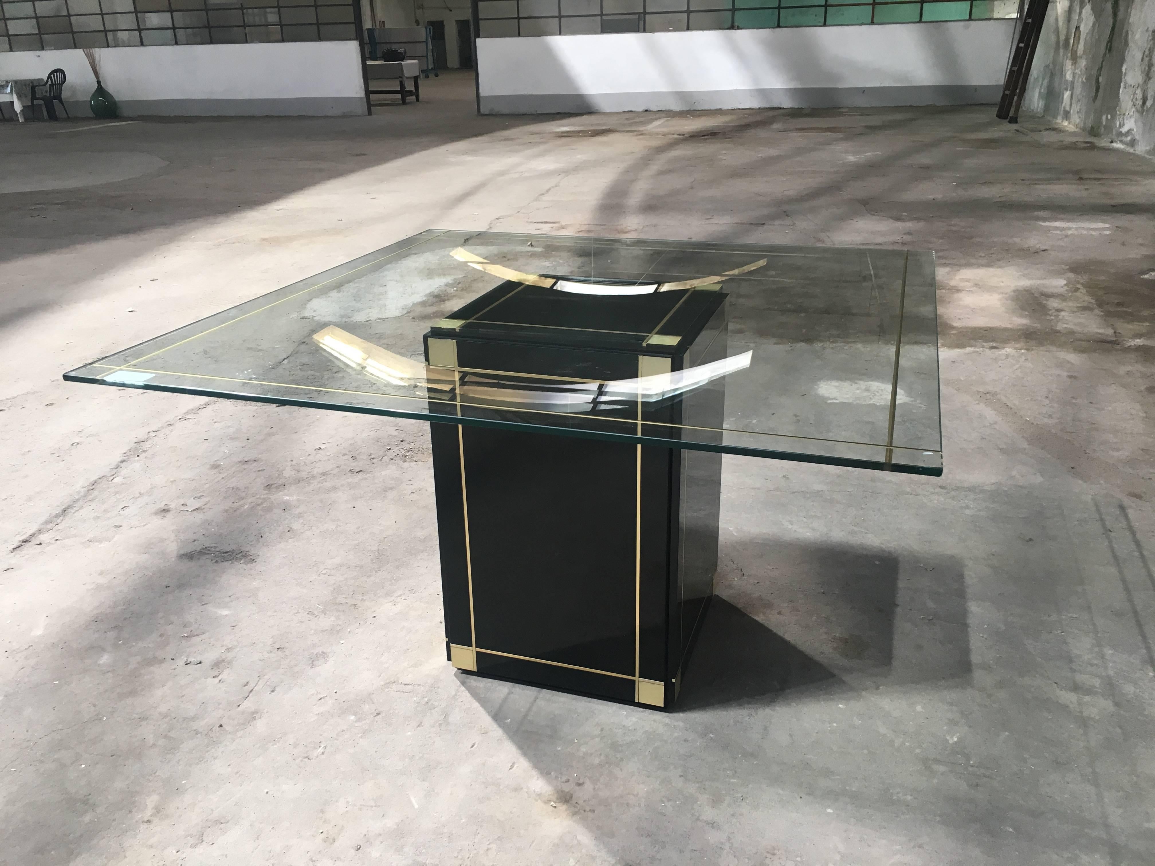 Italian Willy Rizzo centre or dining table with black lacquered wood base and glass top with gilded decoration from 1970s.