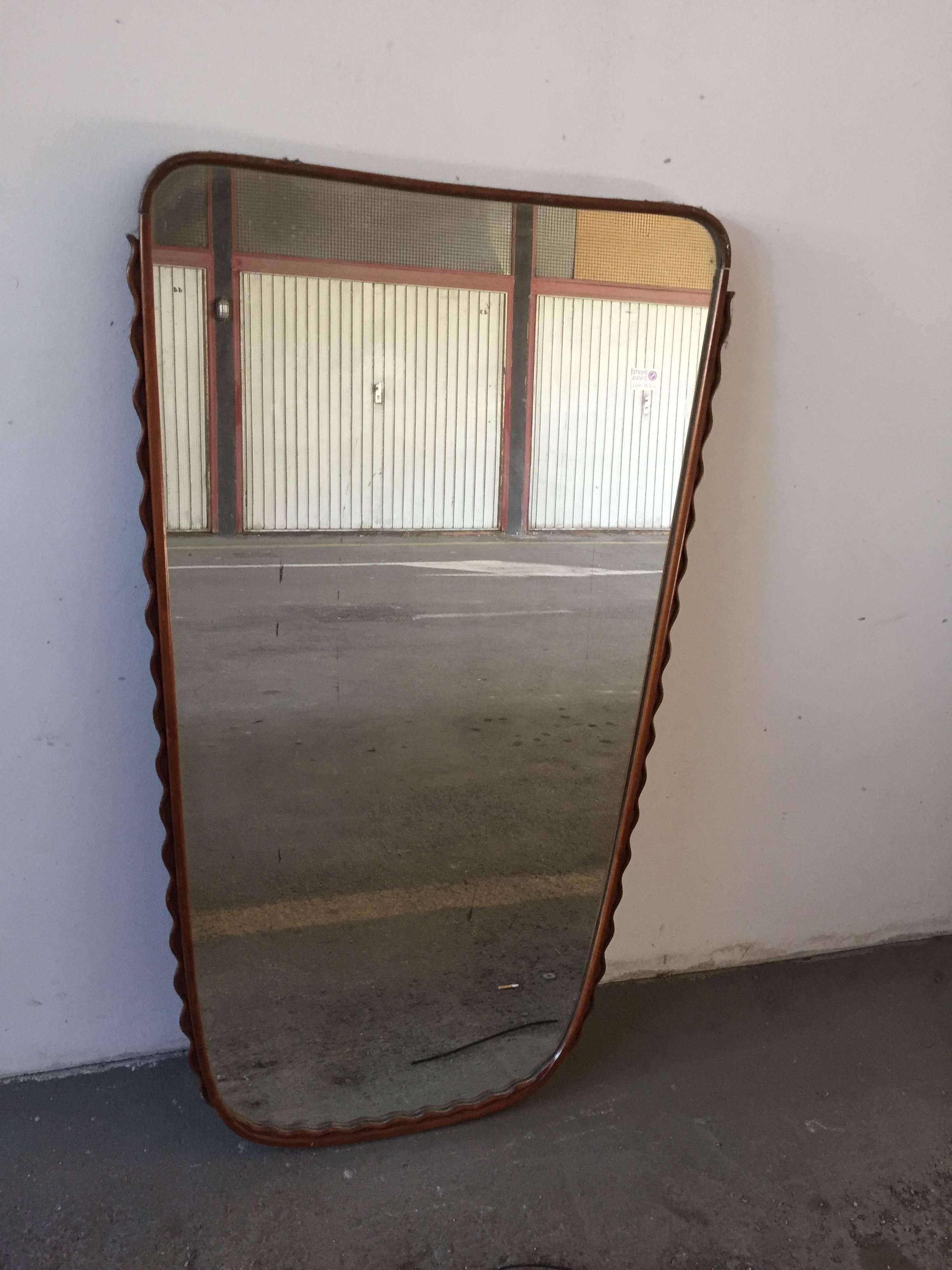 Midcentury Italian wall mirror with bent cherry frame attributed to Osvaldo Borsani, 1950s.