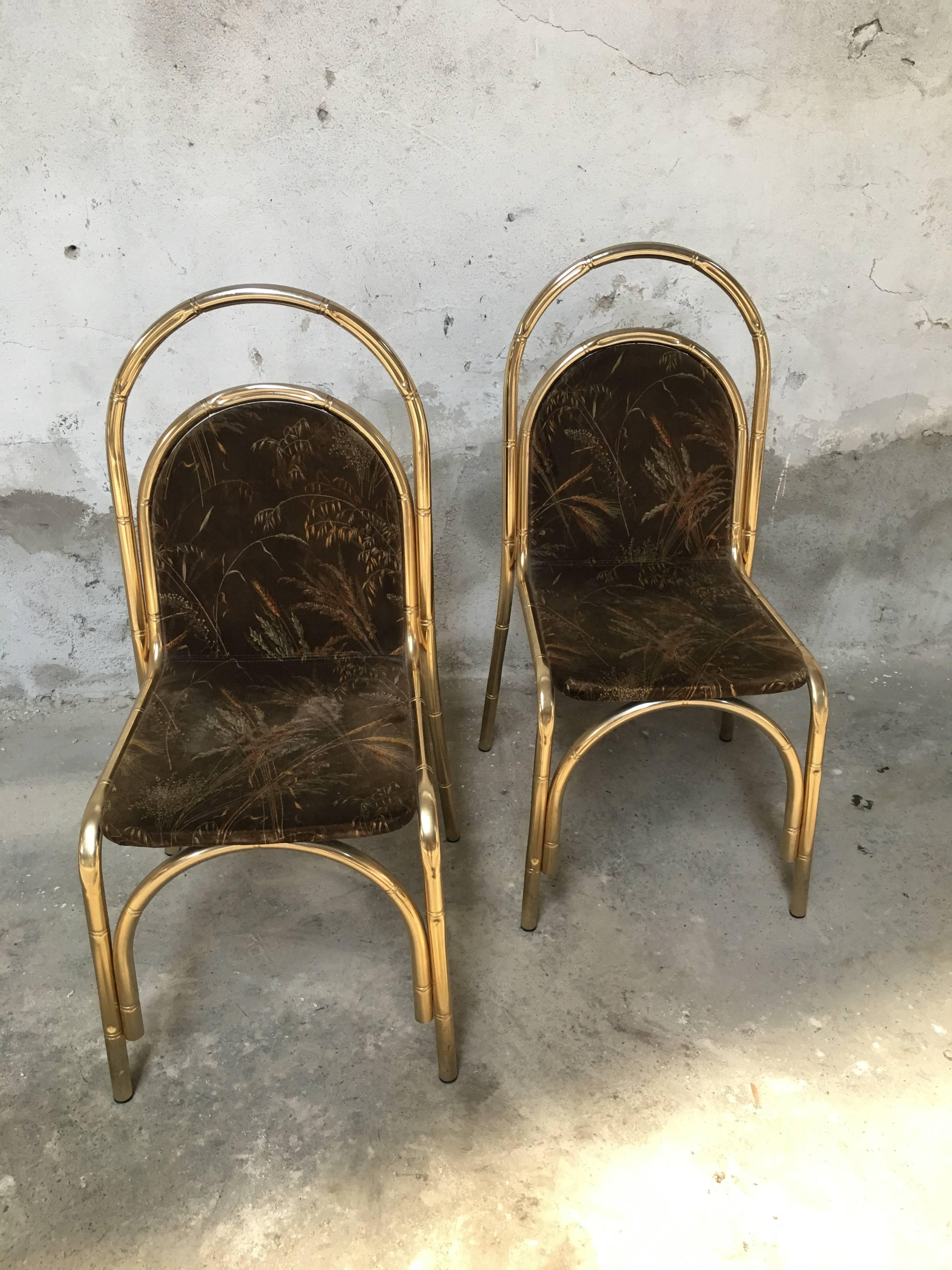 Italian Pair of gilt metal faux bamboo chairs with original fabric from 1970s.