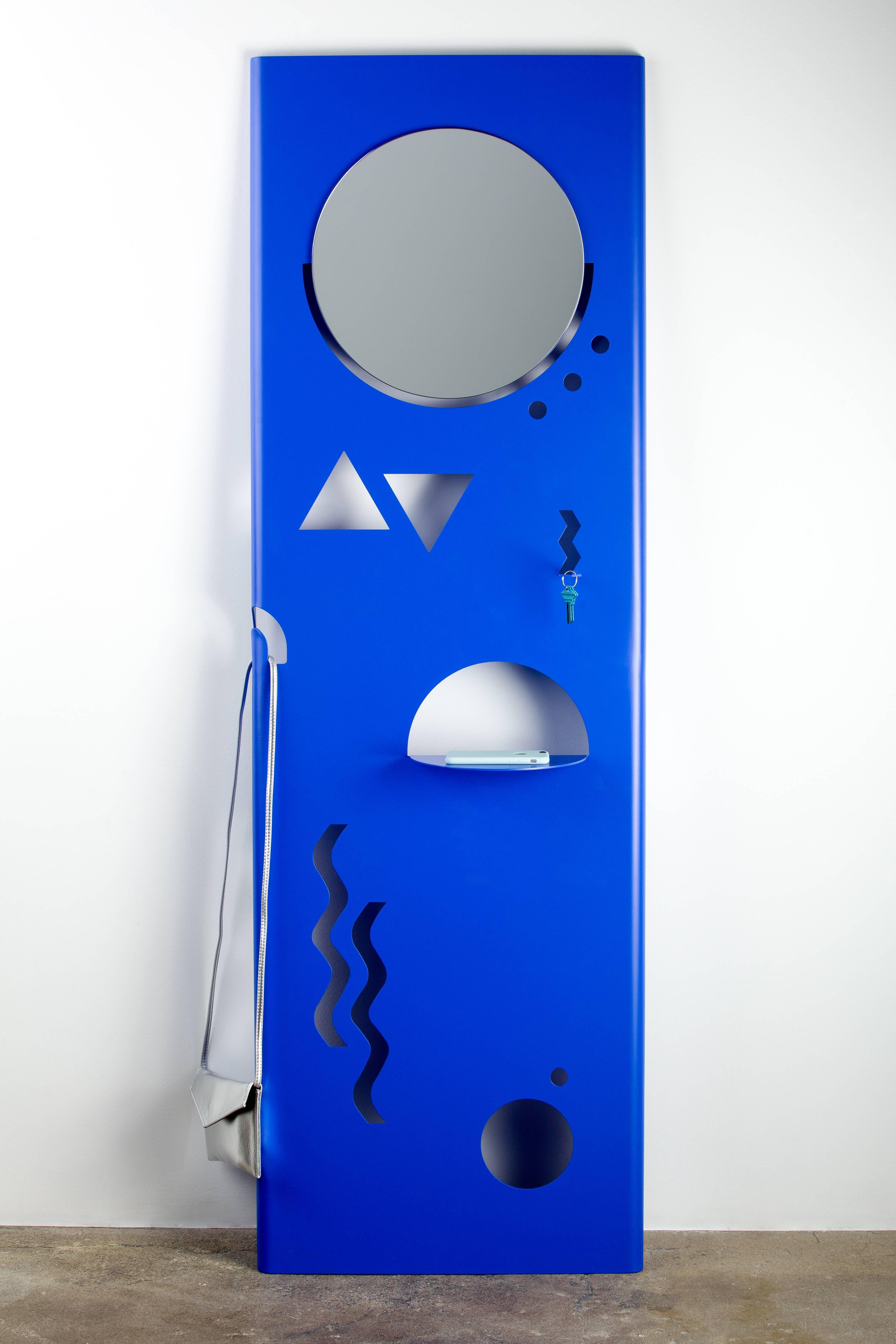 Inspired by Memphis shapes, Just Cant was developed as an abstract interpretation of what a valet can be. With a mirror, key hook, coat hook and shelf, Just Cant functions entirely the way a valet needs to function, without looking like any valet