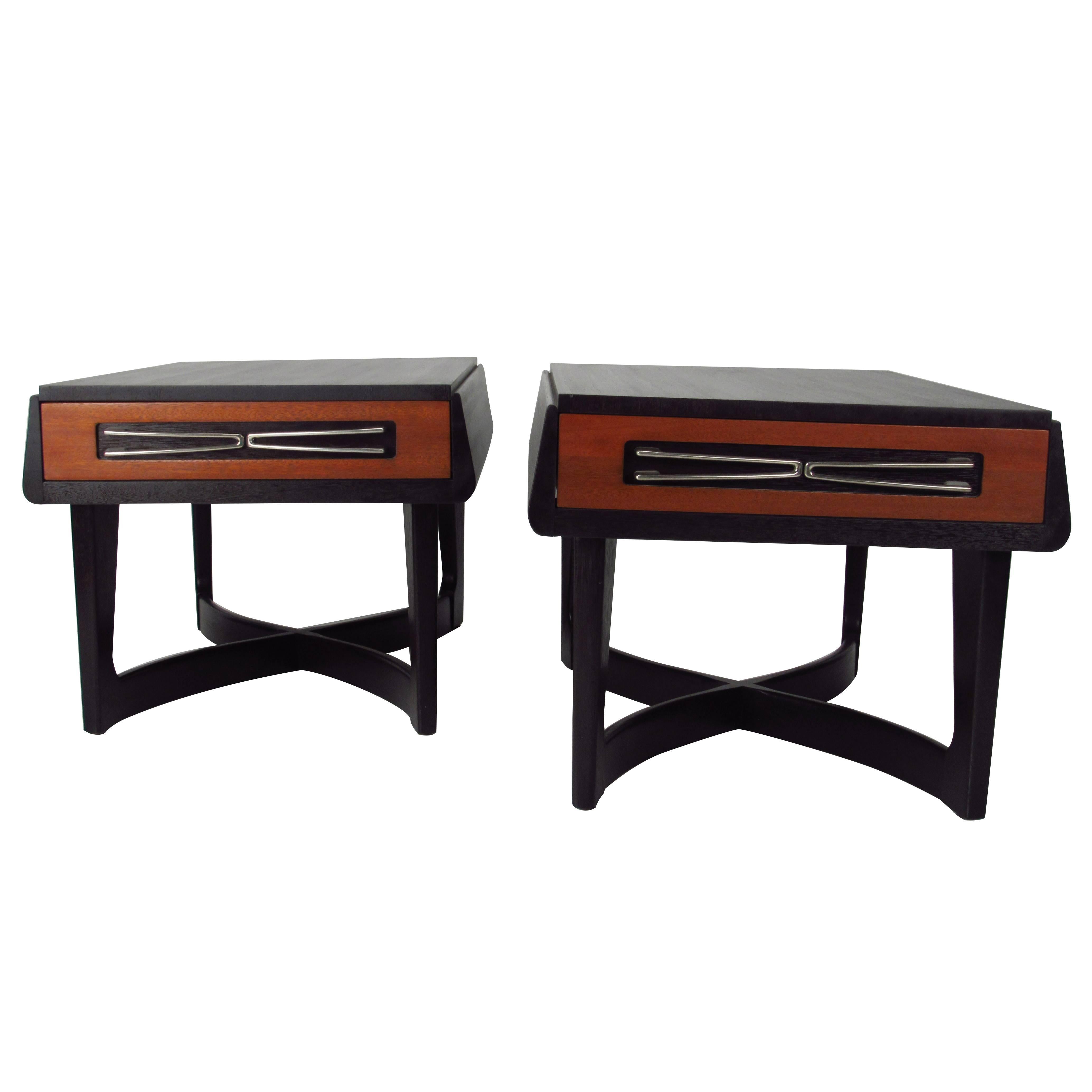 Pair of Tables attributed to Paul Laszlo for Brown Saltman of California, USA, 1950s.  Sculptural pair of tables in ebonized mahogany with natural mahogany drawer fronts and chrome-plated hardware. 
   