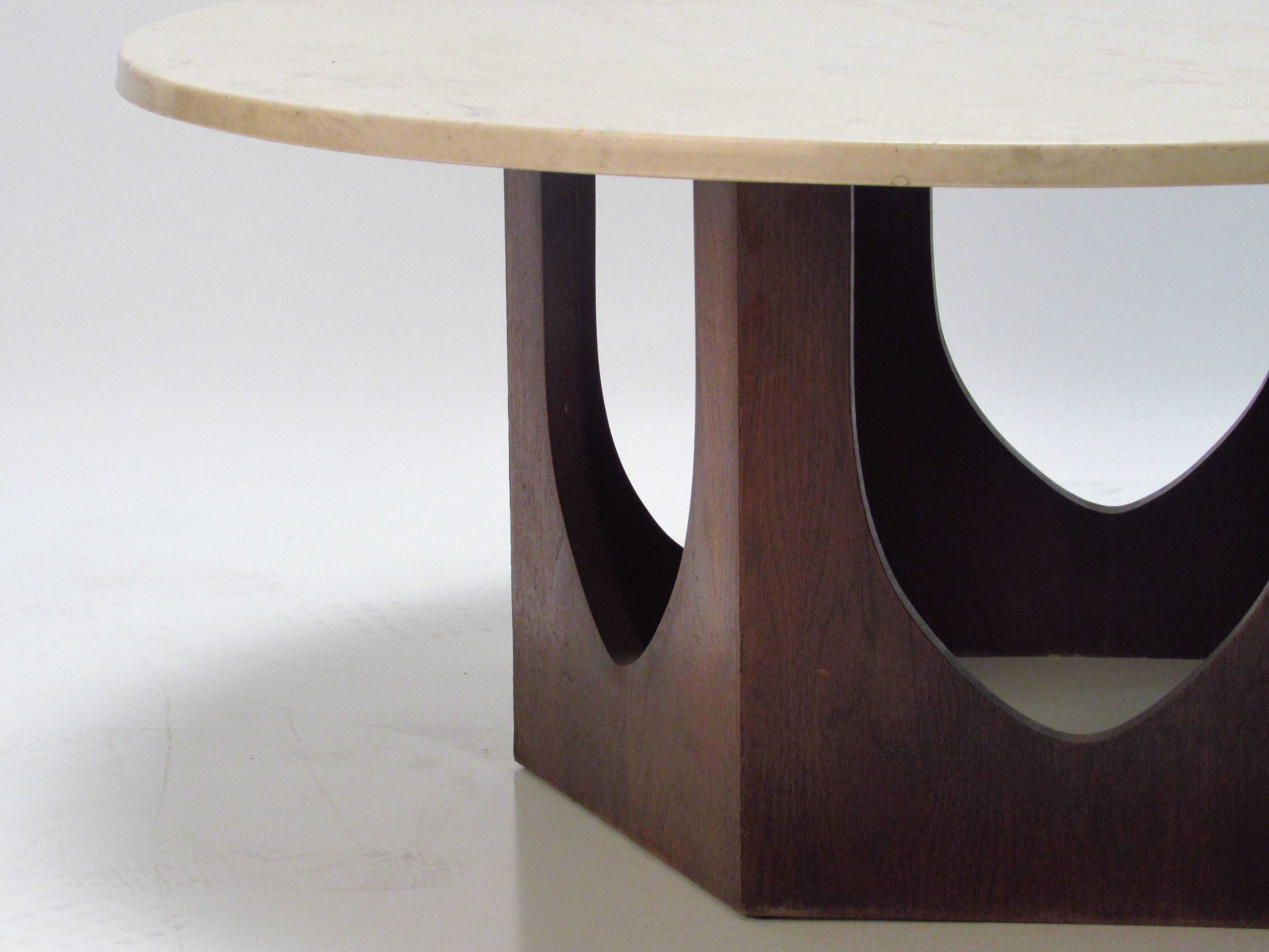 Harvey Probber Travertine and Walnut Mid-Century Modern Coffee Table, 1960s.   Mid-Century Modern round end or occasional table designed by Harvey Probber, dating from the 1960s. It features a travertine marble round top over a sculptural walnut