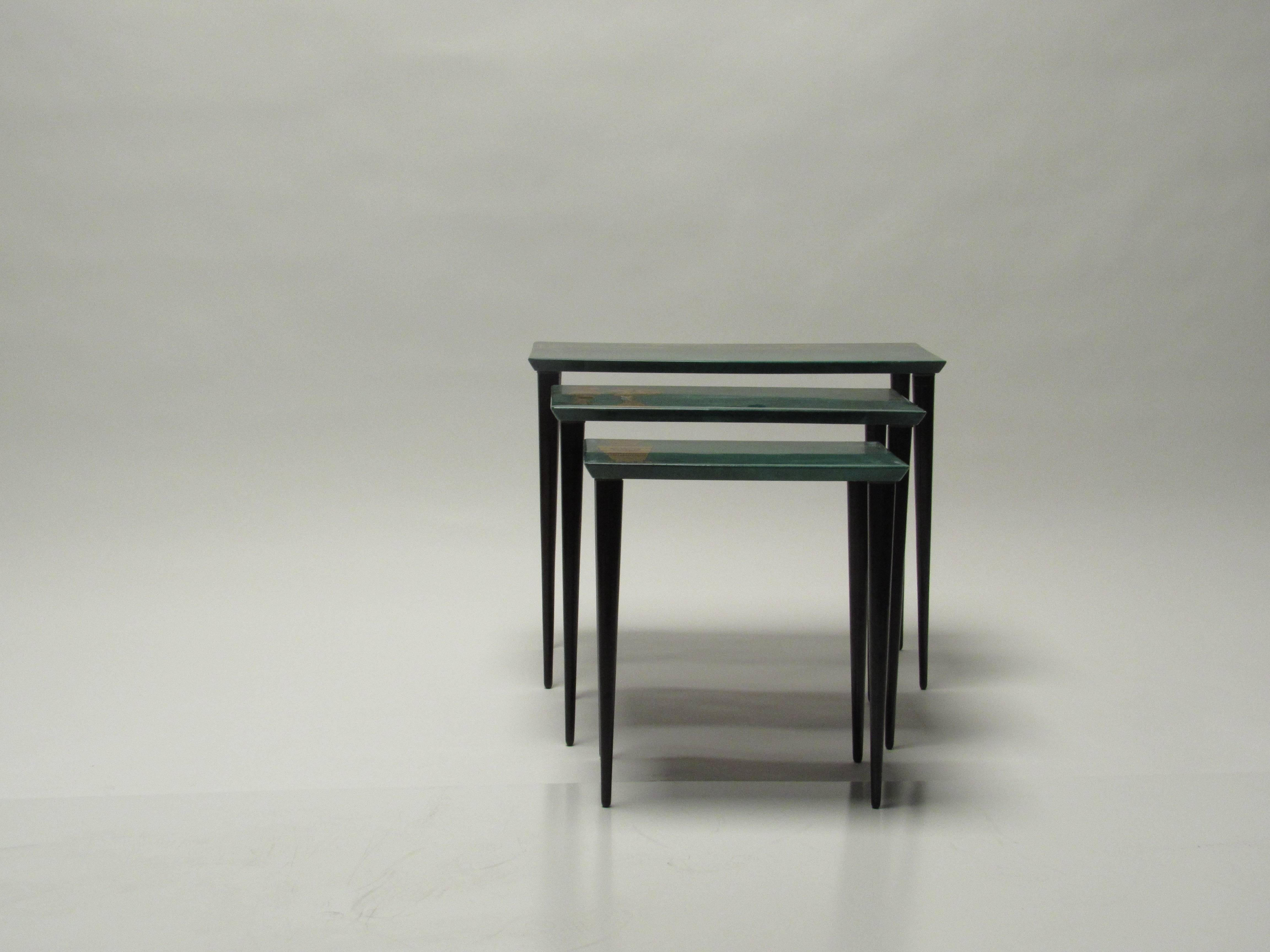 Aldo Tura Nesting Tables in Emerald Green Goatskin, Italy,  1950s.  Aldo Tura’s sense of humor and playfulness along with his use of luxury materials, exceptional level of craftsmanship, and spirit of glamorous hospitality are showcased in this set