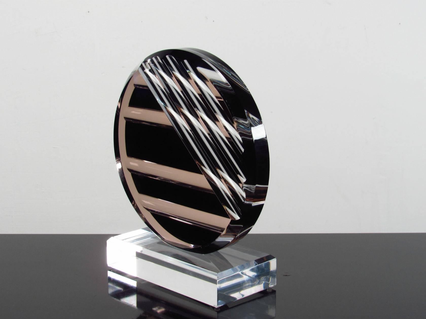 Lucite 1980s Abstract Modern Disc Sculpture.  Cool modern sculpture of thick carved lucite with geometric pattern.  Attribution to Schlomi Haziza. 