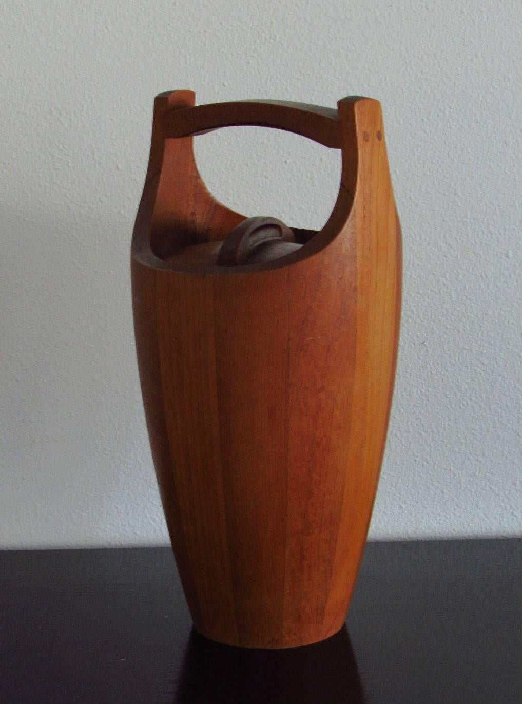 Jens Quistgaard iconic teak ice bucket with orange liner for Dansk, 1958.  In very good original condition. Stamped on bottom.