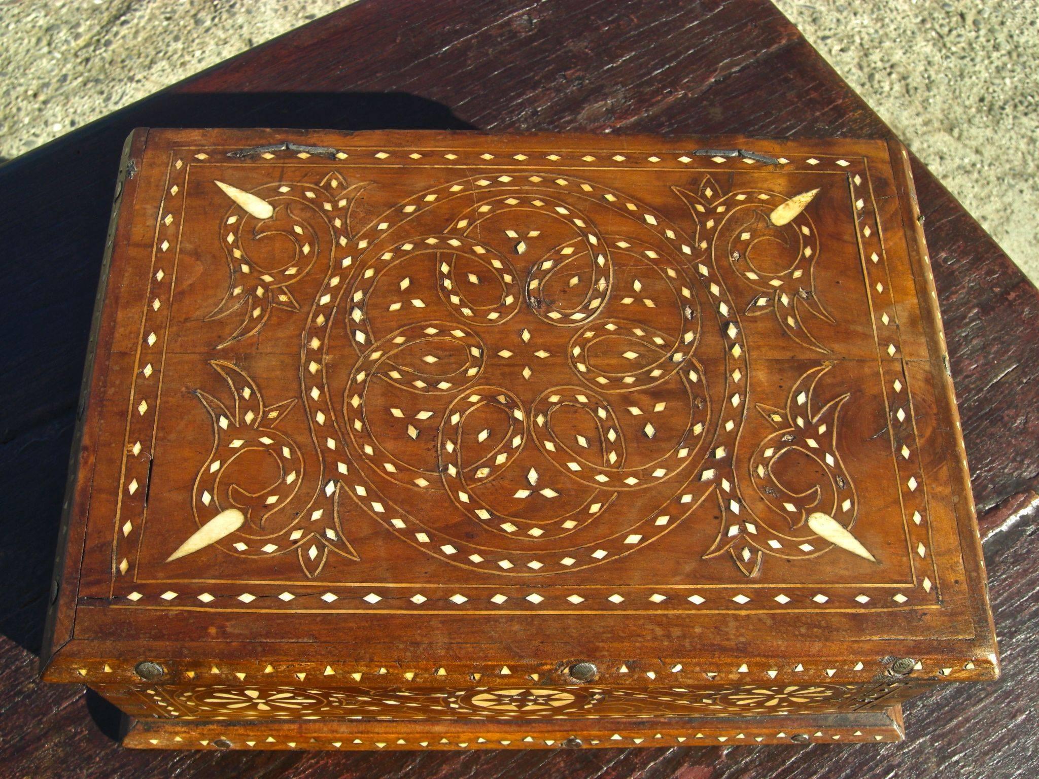 From the region of Aragon in north-central Spain, this mid-19th century walnut and chestnut tabletop box retains its original patina throughout, and beautifully executed arabesque and star designs of bone inlay on top, front and