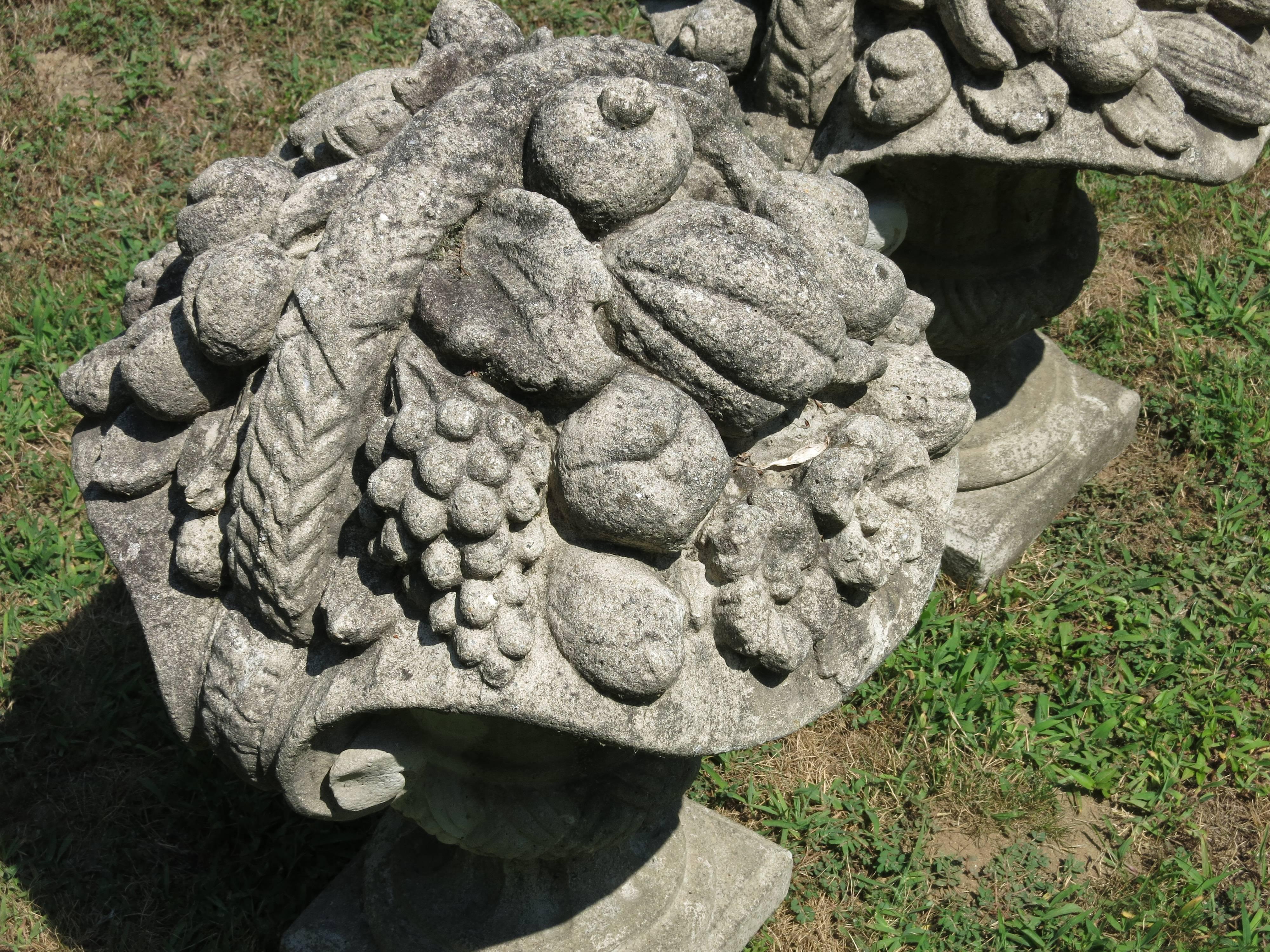 Pair of vintage cast stone baskets of fruit. They measures are 27