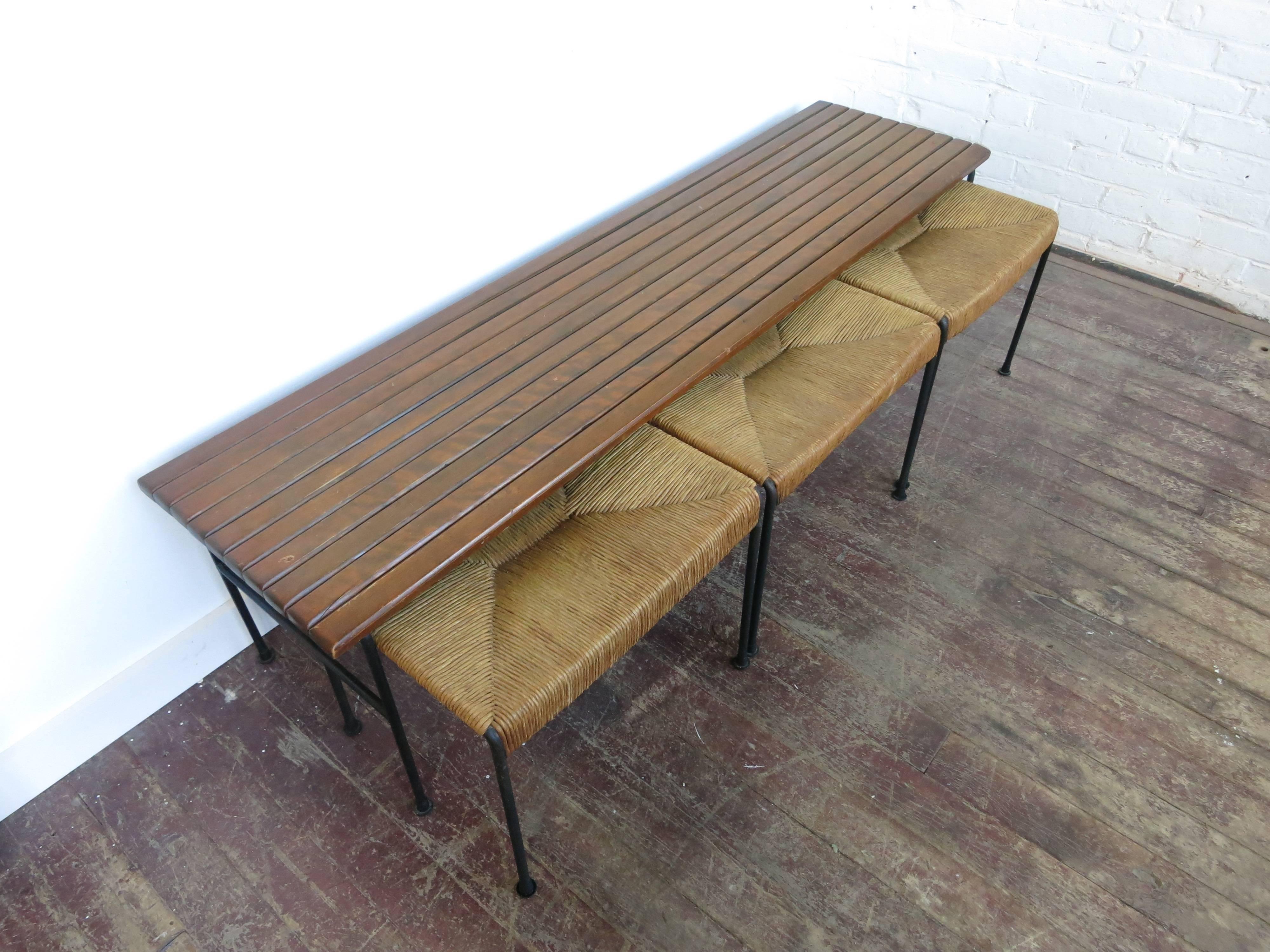 Arthur Umanoff bench and stools for Raymor, 1957. Maple slat bench 60
