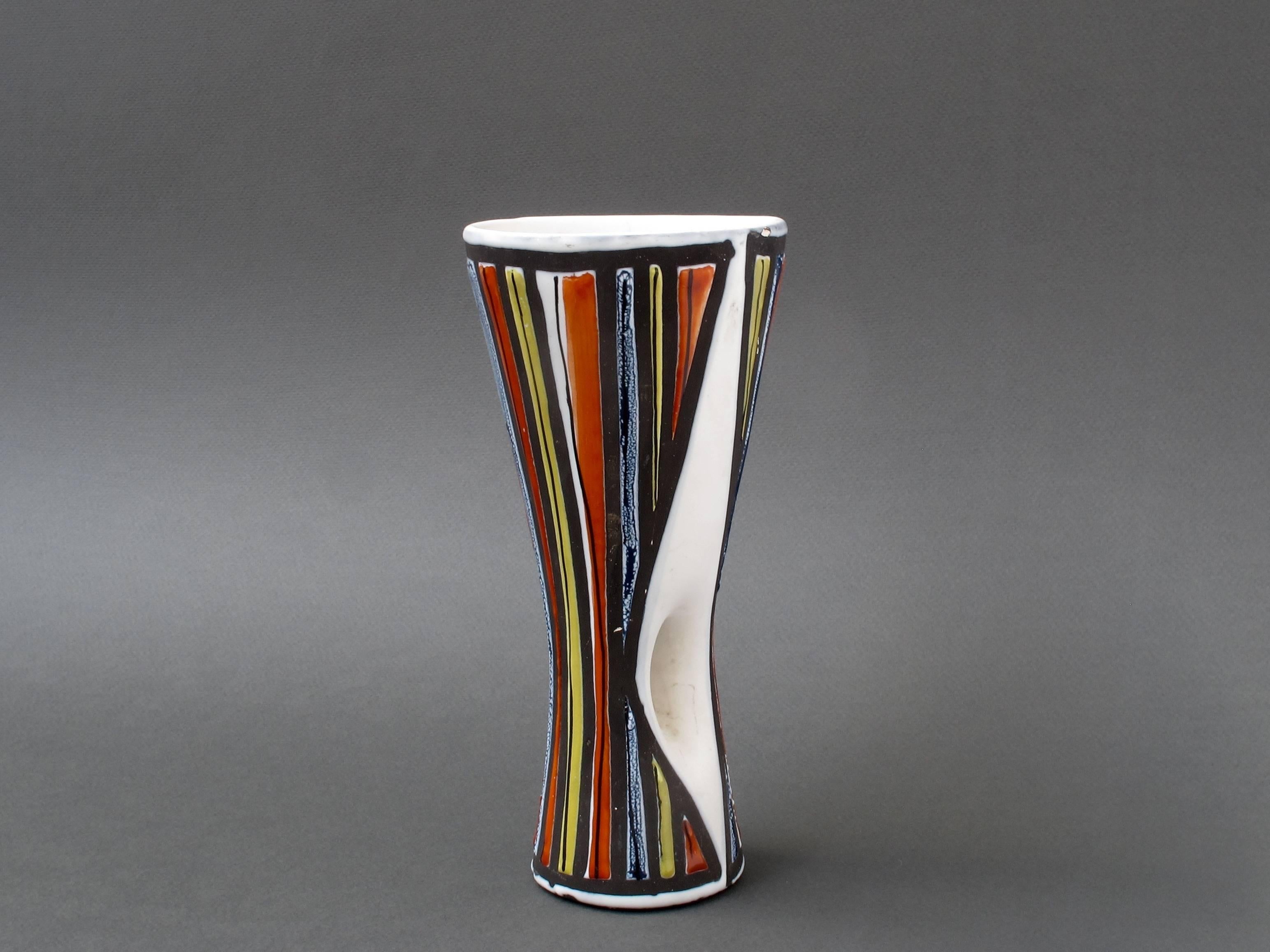 A stylised vase (1950s) by ceramicist Roger Capron (Sept 1922 - Nov 2006) who founded the craft-based workshop in Vallauris, France, l'Atelier Callis, where his creations contributed to a veritable renaissance of pottery and ceramics. Capron left