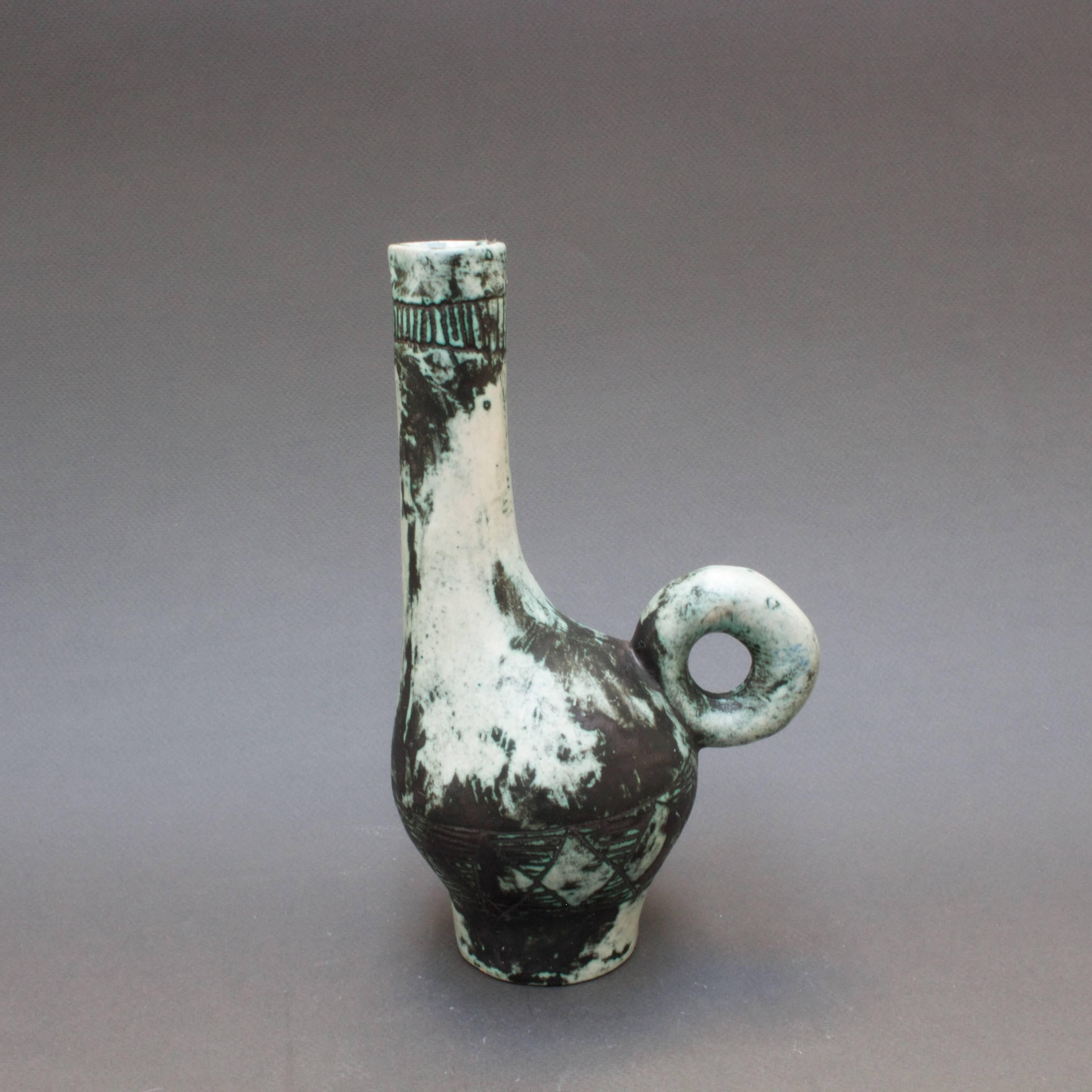 Ceramic spirits pitcher (c. 1950s) by Jacques Blin (1920 - 1995), an engineer by trade but with a love for the visual arts and an immediately recognisable style. A way of working characterised by a more or less misty appearance of the glaze and by