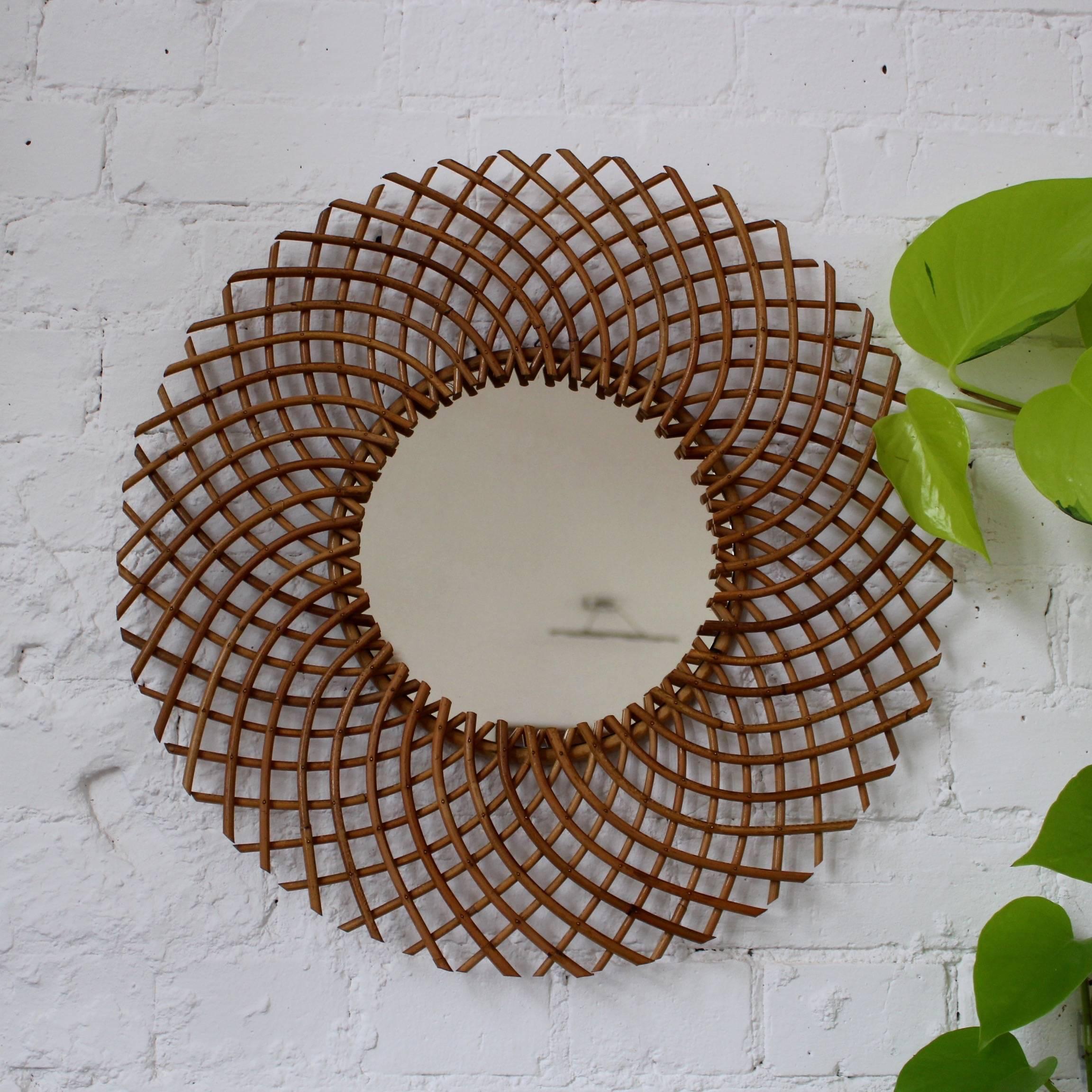 Stylish and very original French (circa 1960s) rattan sun mirror with a complex 'weave' and sophisticated look. This mirror is in excellent condition consistent with its age and use. The original production stamp 'Art Vannerie RR' appears on the