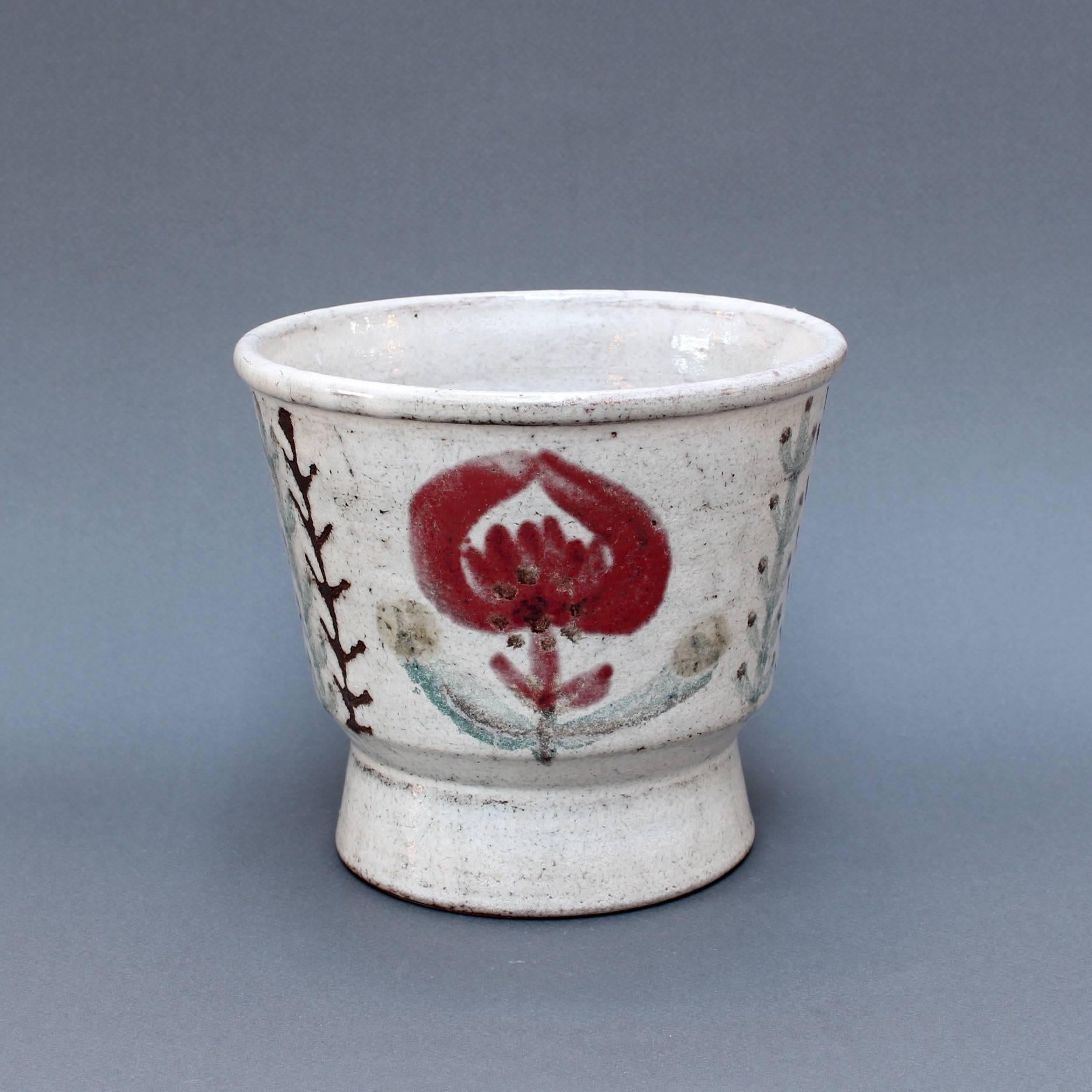 Ceramic plant pot (circa 1960s) by Gustave Reynaud (1915 - 1972) at Le Mûrier studios. A very charming planter with red flower motif on one side of the surface with a French rooster of the same colour on the other. The underlying glaze is a delicate