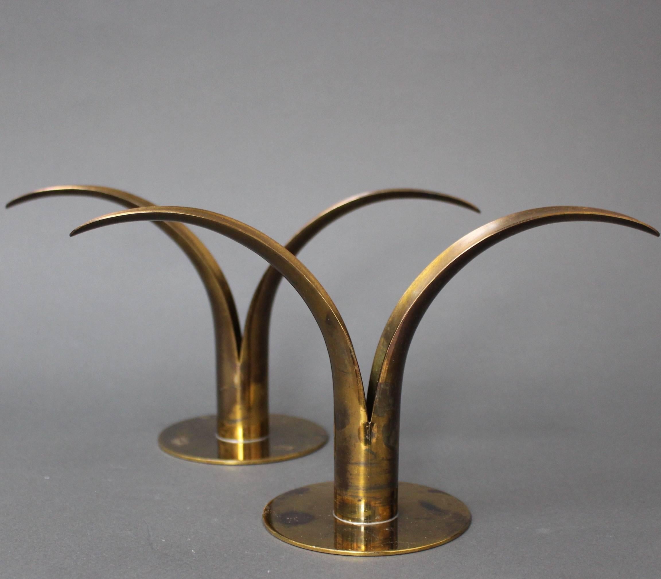 A pair of midcentury split leaf lily brass-plated candle holders by Scan, Sweden. Elegant, graceful and very stylish candle holders with an aged patina. A video clip of this piece may be provided upon request.

Dimensions:
W 22 cm (8.66
