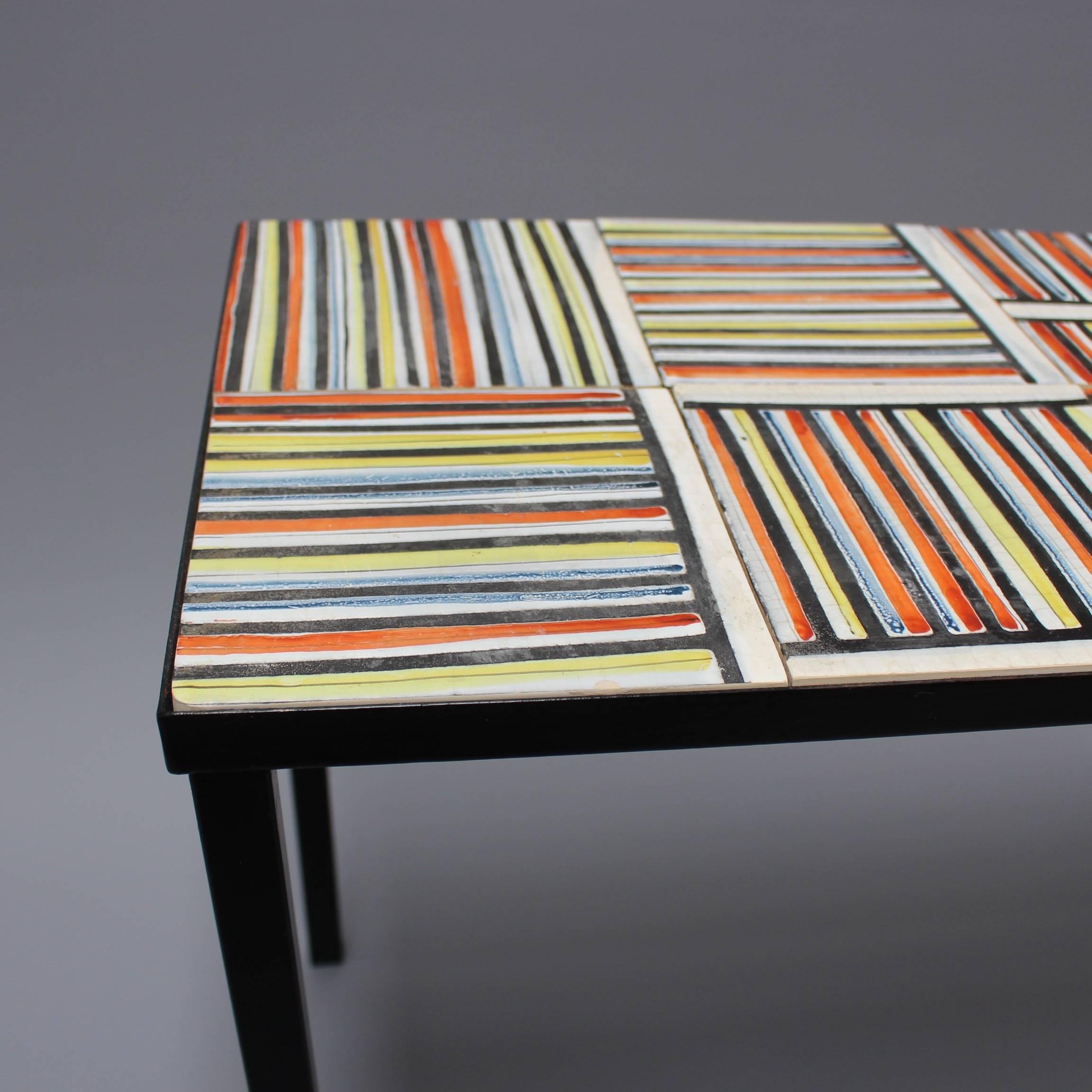 Coffee table with colourful ceramic tiles by artist Roger Capron (1922-2006), who founded the craft-based workshop in Vallauris, France, l'Atelier Callis, where his creations contributed to a veritable renaissance of pottery and ceramics. Capron