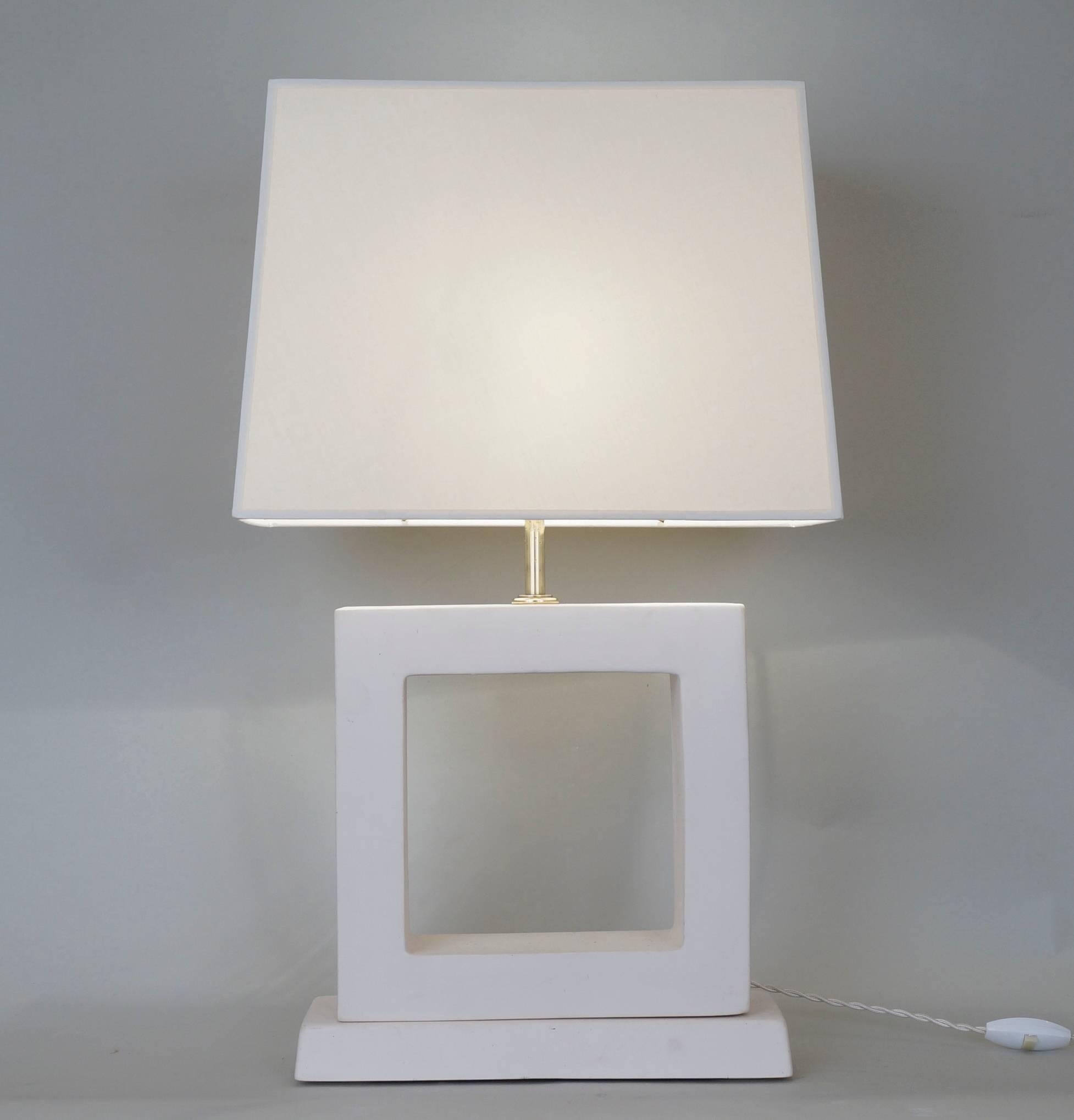 Geometric white unglazed ceramic table lamp.
Custom-made fabric lampshade.
Rewired with twisted silk cord. 
US standard plug on request.
Ceramic: 22 cm - 8.7in.
Height with lampshade: 61 cm - 24in. 

