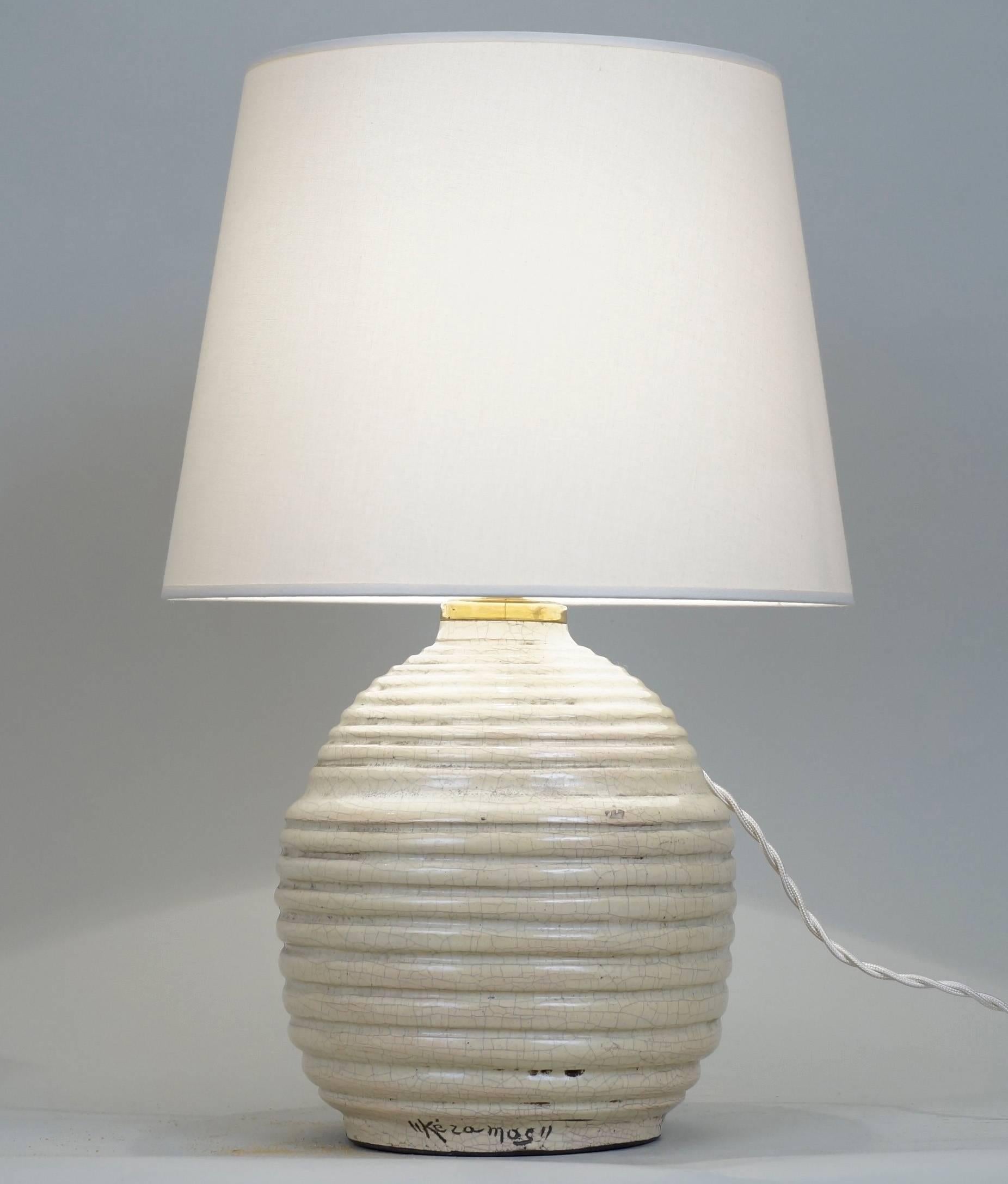 Spheral crackled ceramic table lamp signed Keramos.
Custom-made lampshade.
Rewired with twisted silk cord.
US standard plug on request.

Ceramic height: 21 cm - 8.3in.
Height with lampshade: 40 cm - 15.7 in.
   
