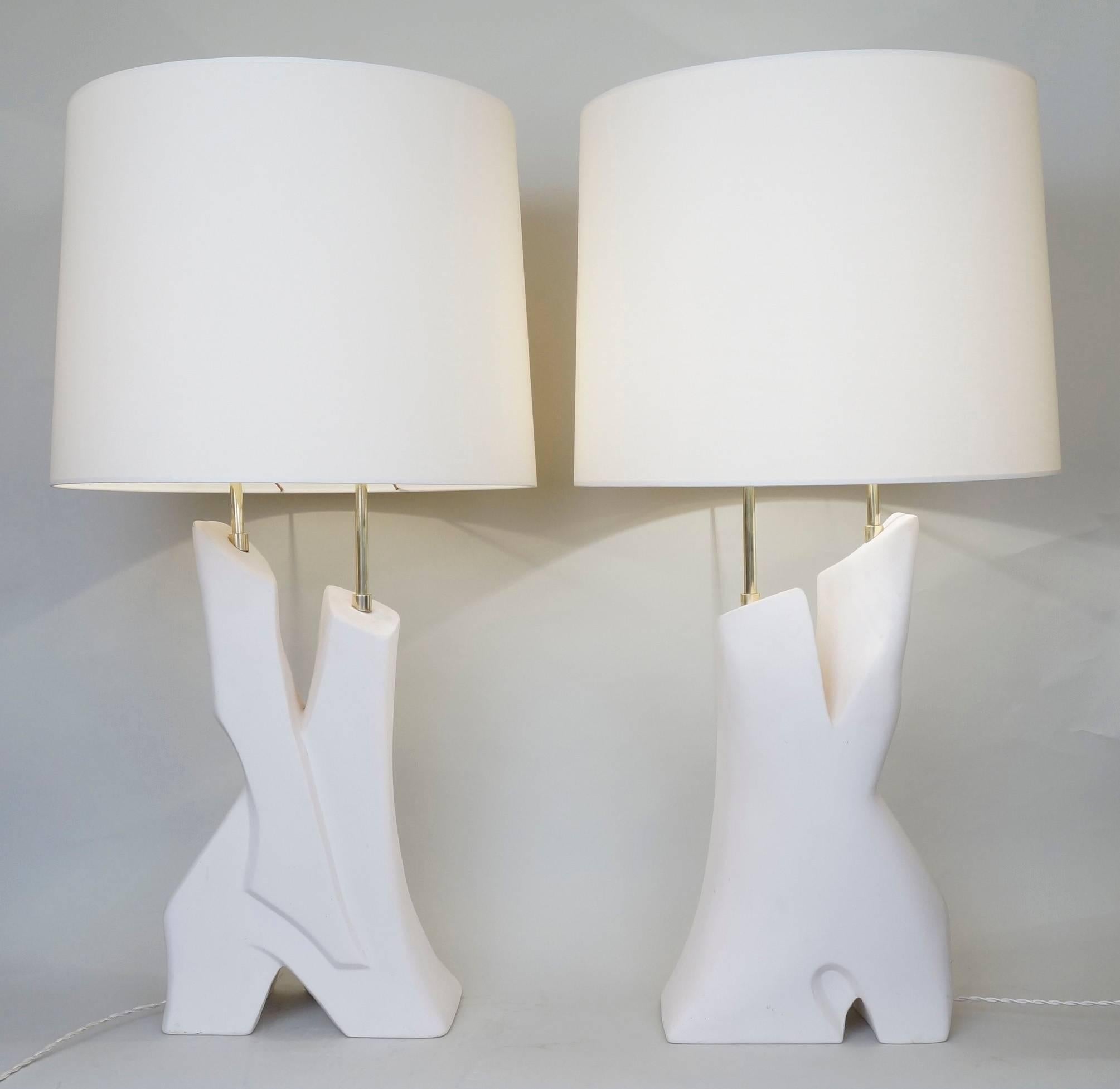 Important pair of un-enameled ceramic table lamps, signed Dorion, manufacture of Desvres.
custom-made fabric lampshades.
Rewired with twisted silk cord. 
US standard plug on request.
Measures: Ceramic height: 49 cm - 19.3in. 
Height with