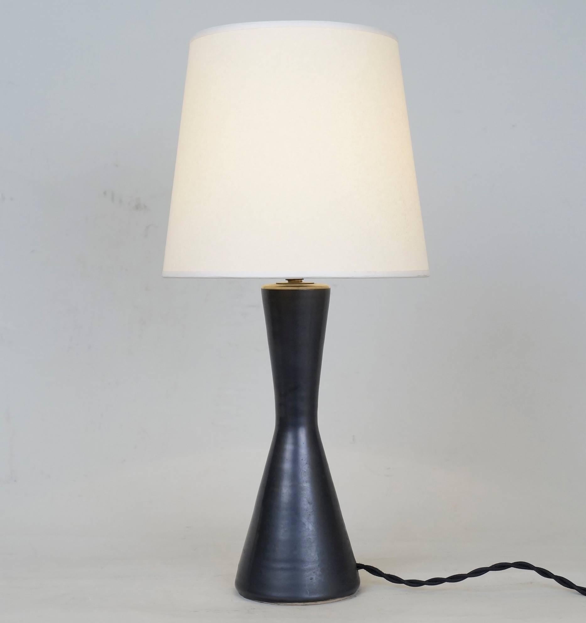 Black satin ceramic table lamp by Pol Chambost signed on the back.
Model 1008.
Custom-made fabric lampshade.
Rewired with twisted silk cord.
US standard plug on request.
Measures: Ceramic body height: 21 cm - 8.3 in.
Height with lampshade: 38
