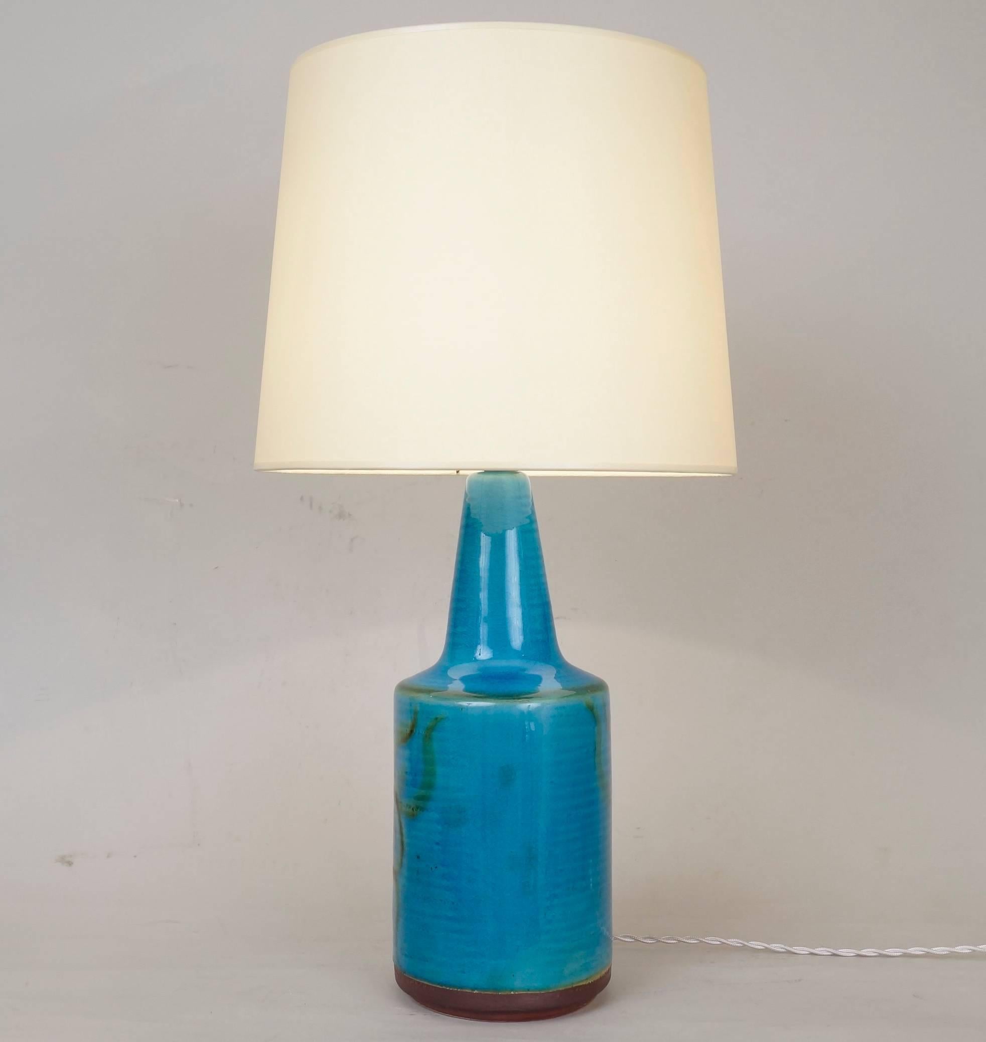 Blue enameled ceramic table lamp
custom-made lampshade.
Rewired with twisted silk cord.
US plug on request.
Measures: Ceramic height 30 cm - 11.8 in.
Height with lampshade 53 cm - 20.9 in.

    